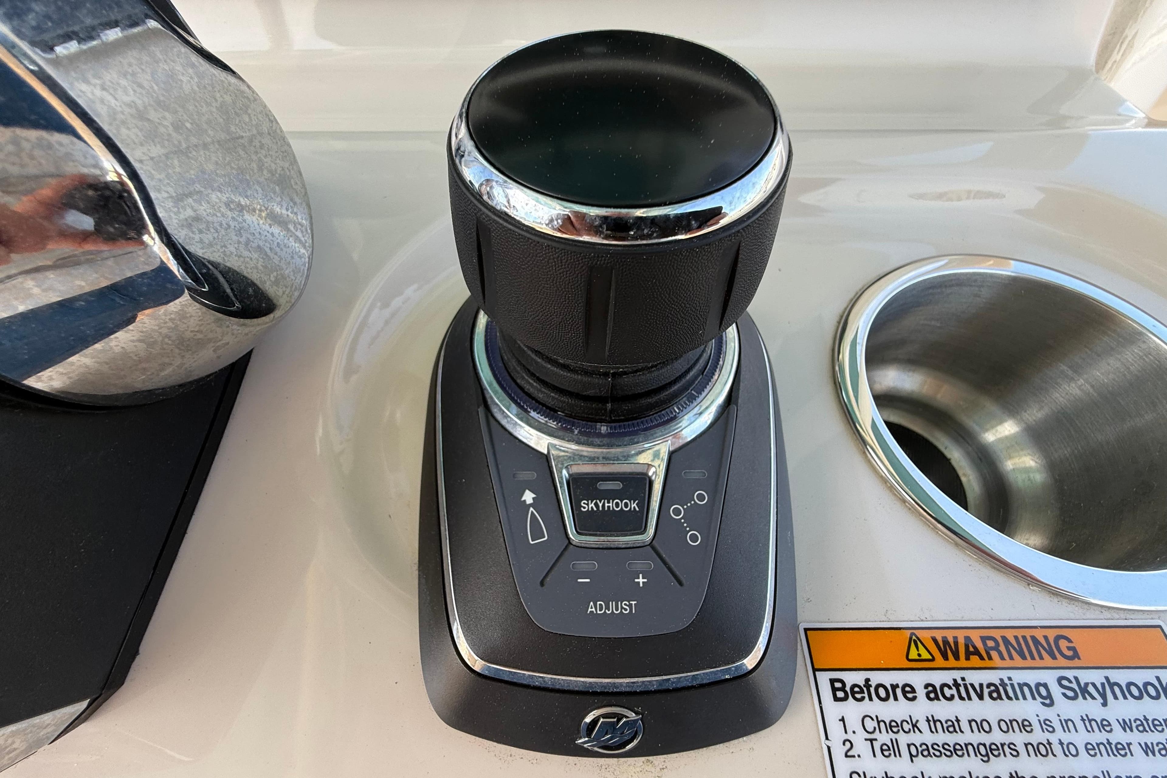 Joystick control panel on 2023 Boston Whaler 280 Outrage boat with Skyhook feature.
