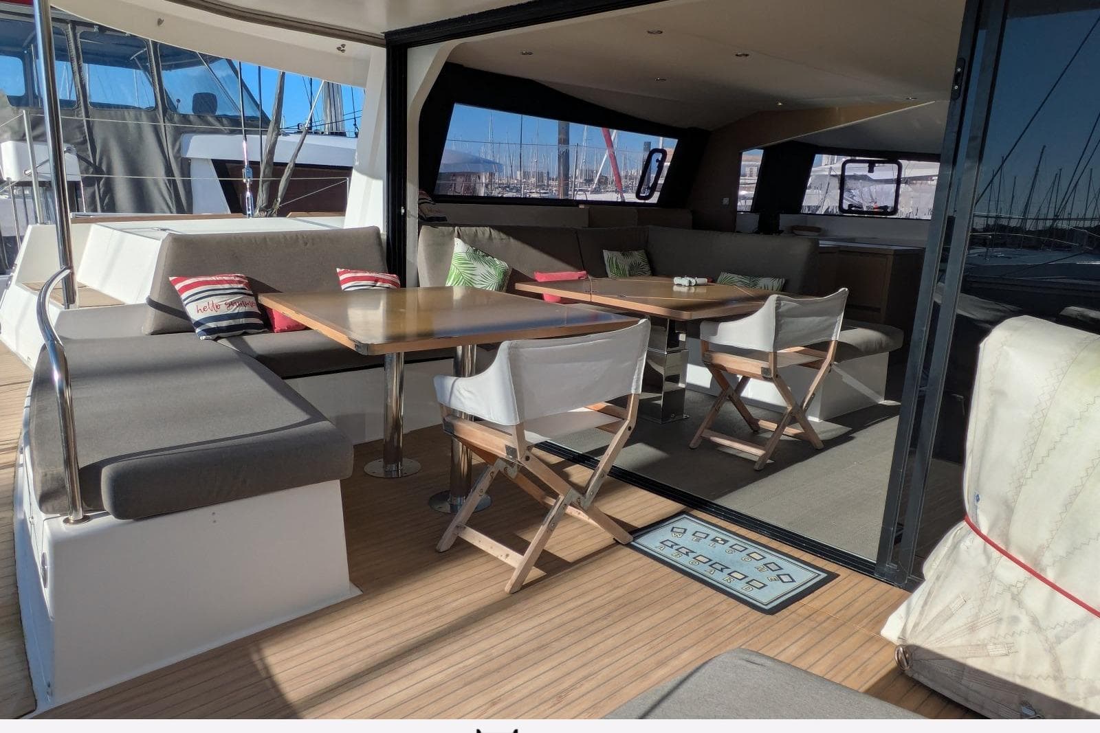 Spacious 2018 NEEL 51 yacht interior with comfortable seating and dining area.