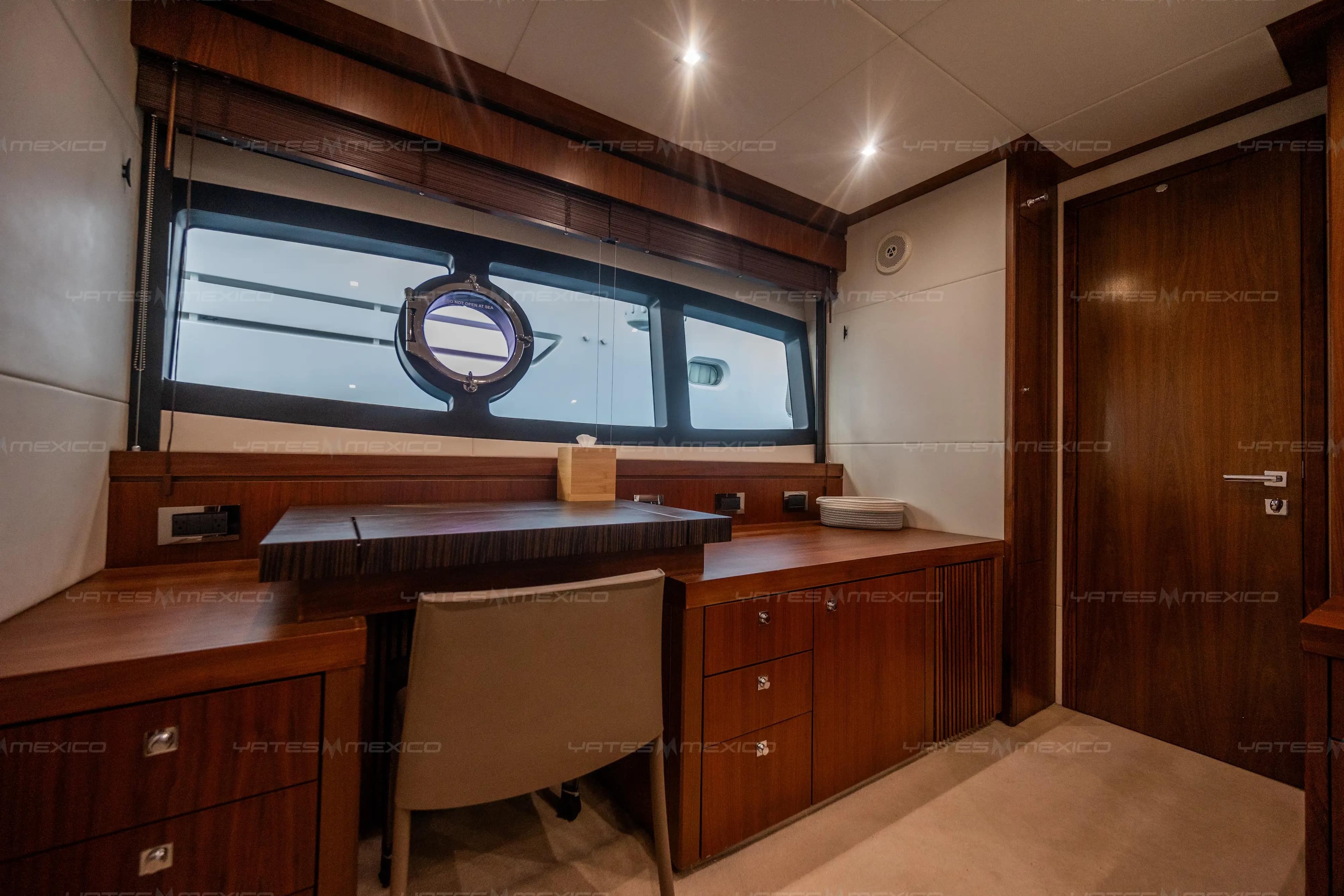 Luxurious interior of a 2015 Sunseeker 75 Yacht with elegant wood furnishings.