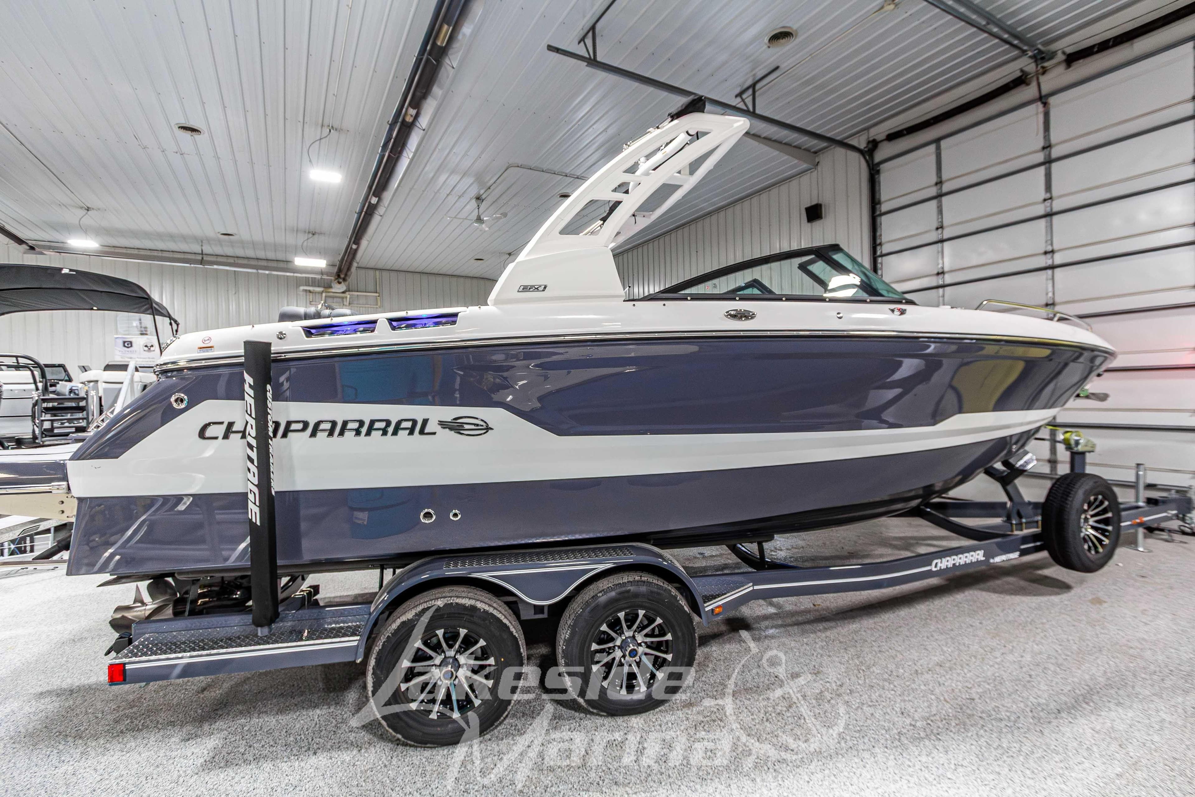 2026 Chaparral SSX 6 boat on trailer in indoor showroom.