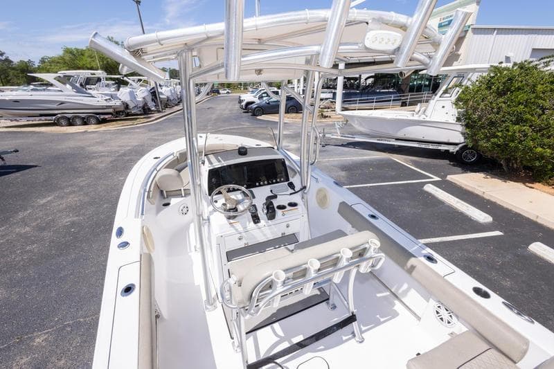 2021 Sportsman Heritage 211 Center Console boat in a marina parking lot.