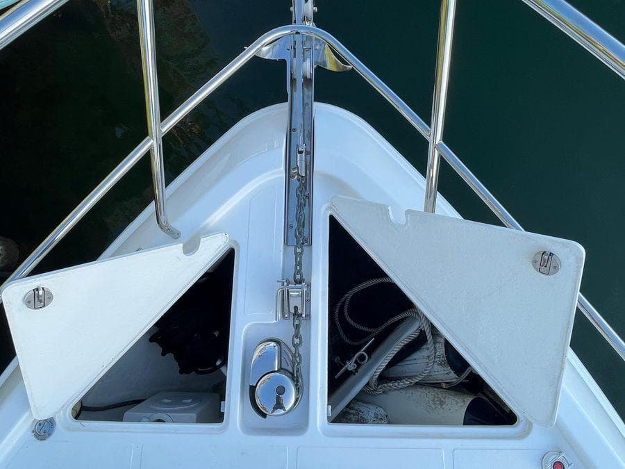 Bow of 2019 Schaefer 510 yacht with open anchor compartments and chain.