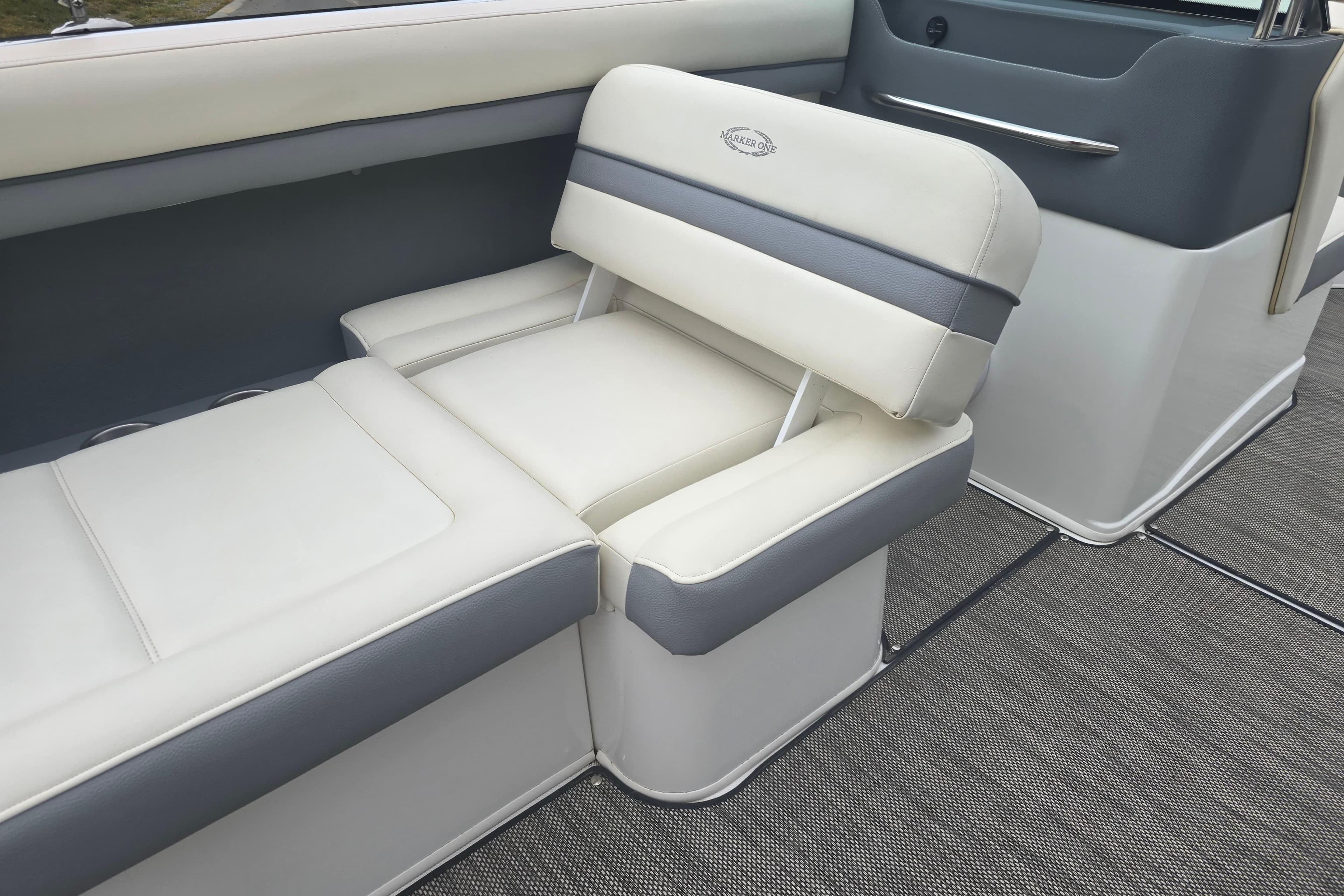 Luxurious seating on 2016 Marker One ML4 boat, featuring white and gray upholstery.