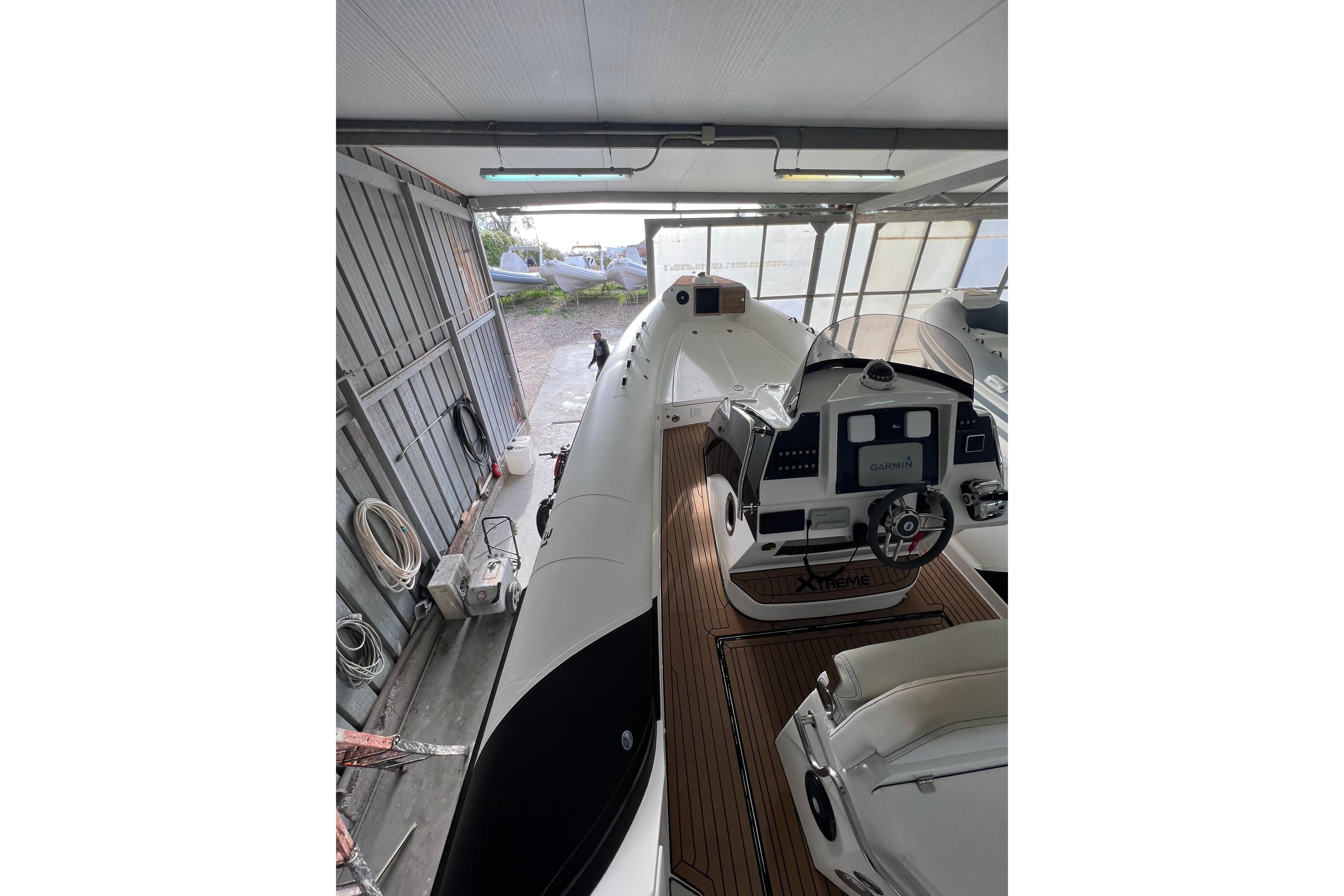 Novamares 31 Extreme 2021 boat in storage, featuring modern cockpit and sleek design.