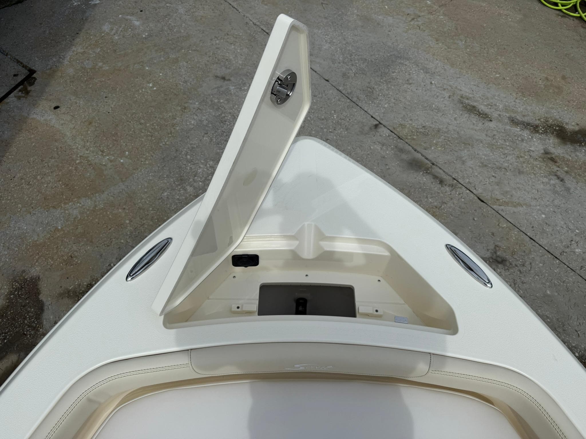 Open storage compartment on 2026 Scout 188 SF boat deck.