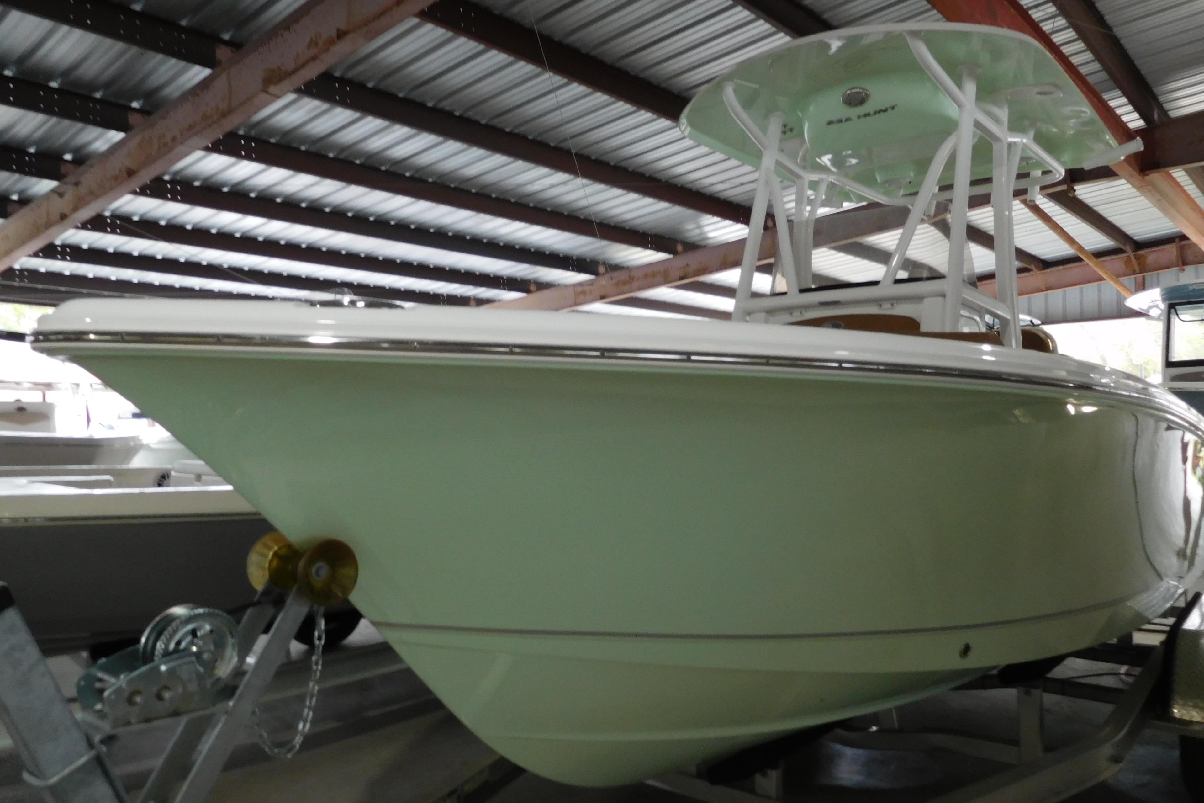 2026 Sea Hunt Ultra 219 boat in storage, showcasing sleek design and modern features.