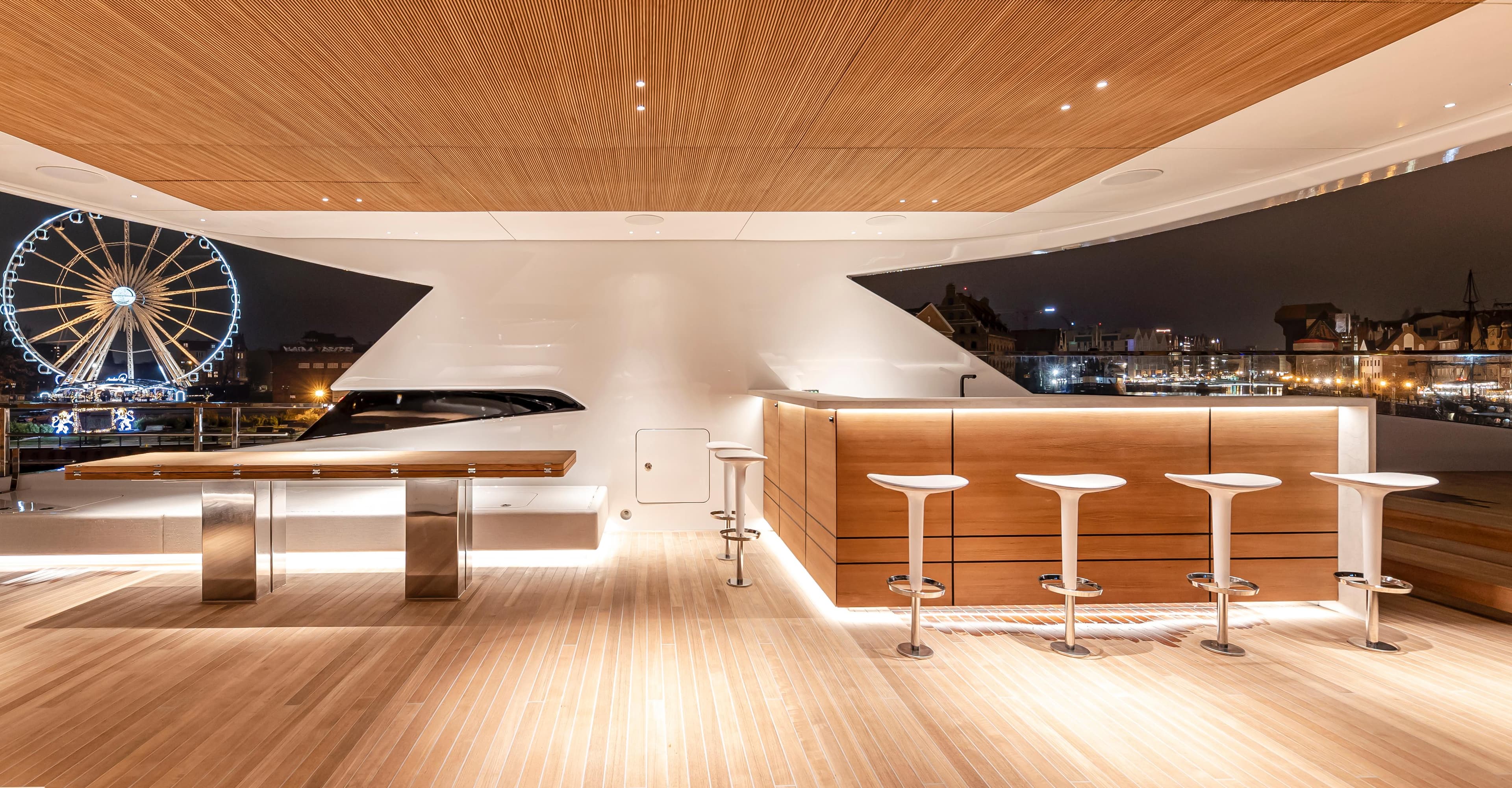 Luxurious Conrad C144S yacht interior with modern bar and cityscape view, 2026 model.