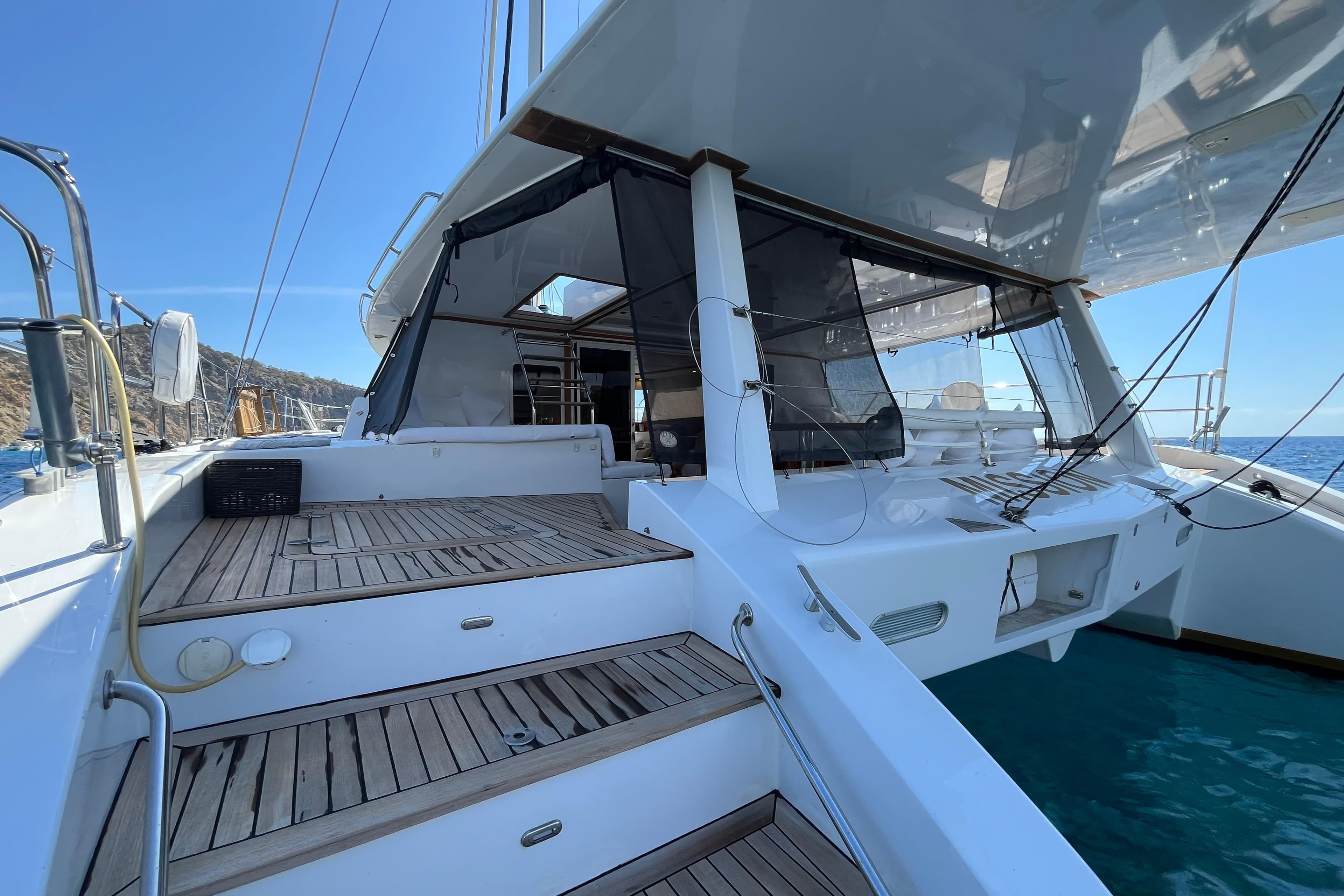 Luxurious 2005 Sunreef 60 yacht with spacious deck and modern design.