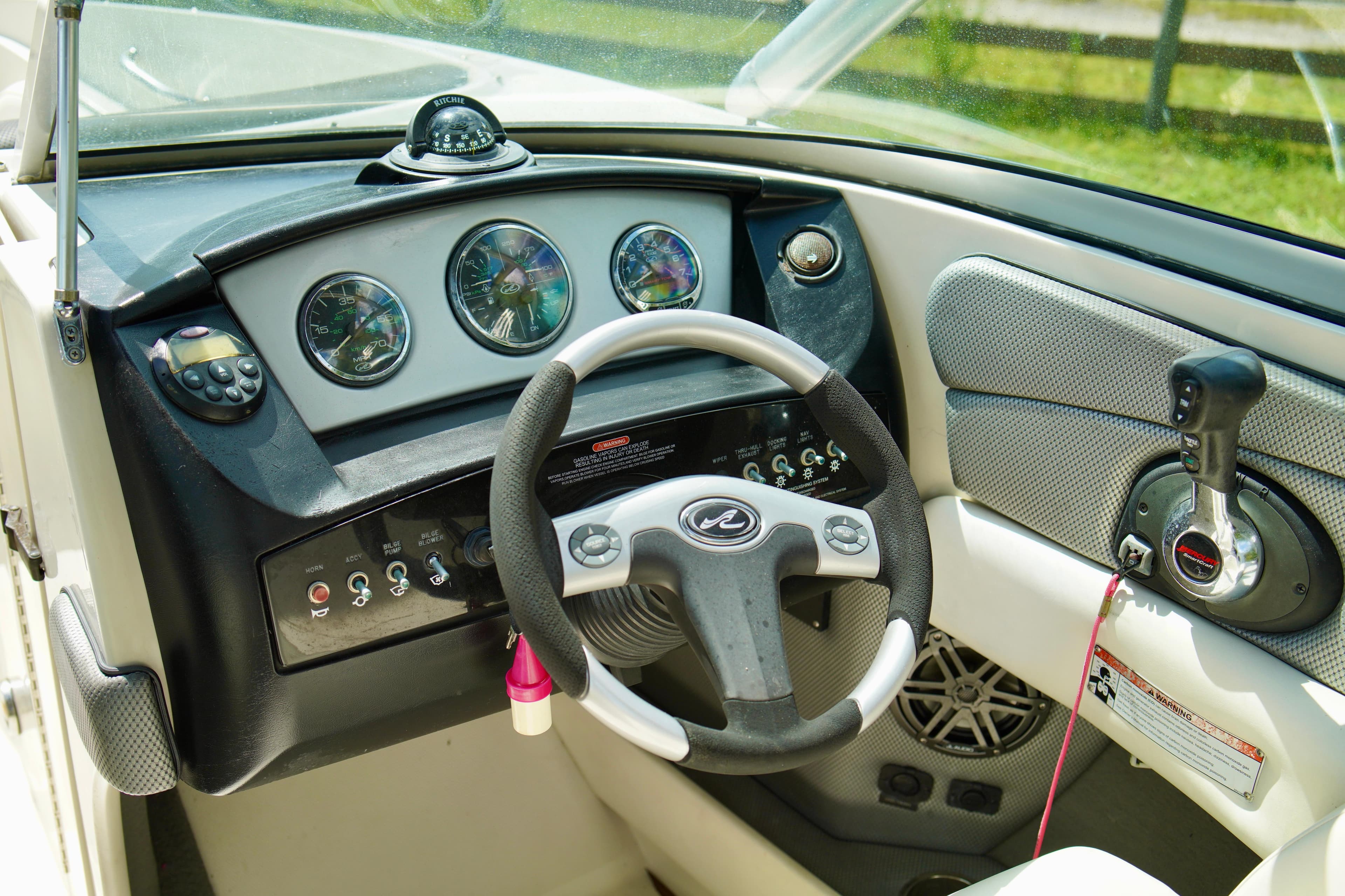 2008 Sea Ray 230 Select Fission boat dashboard and steering wheel.