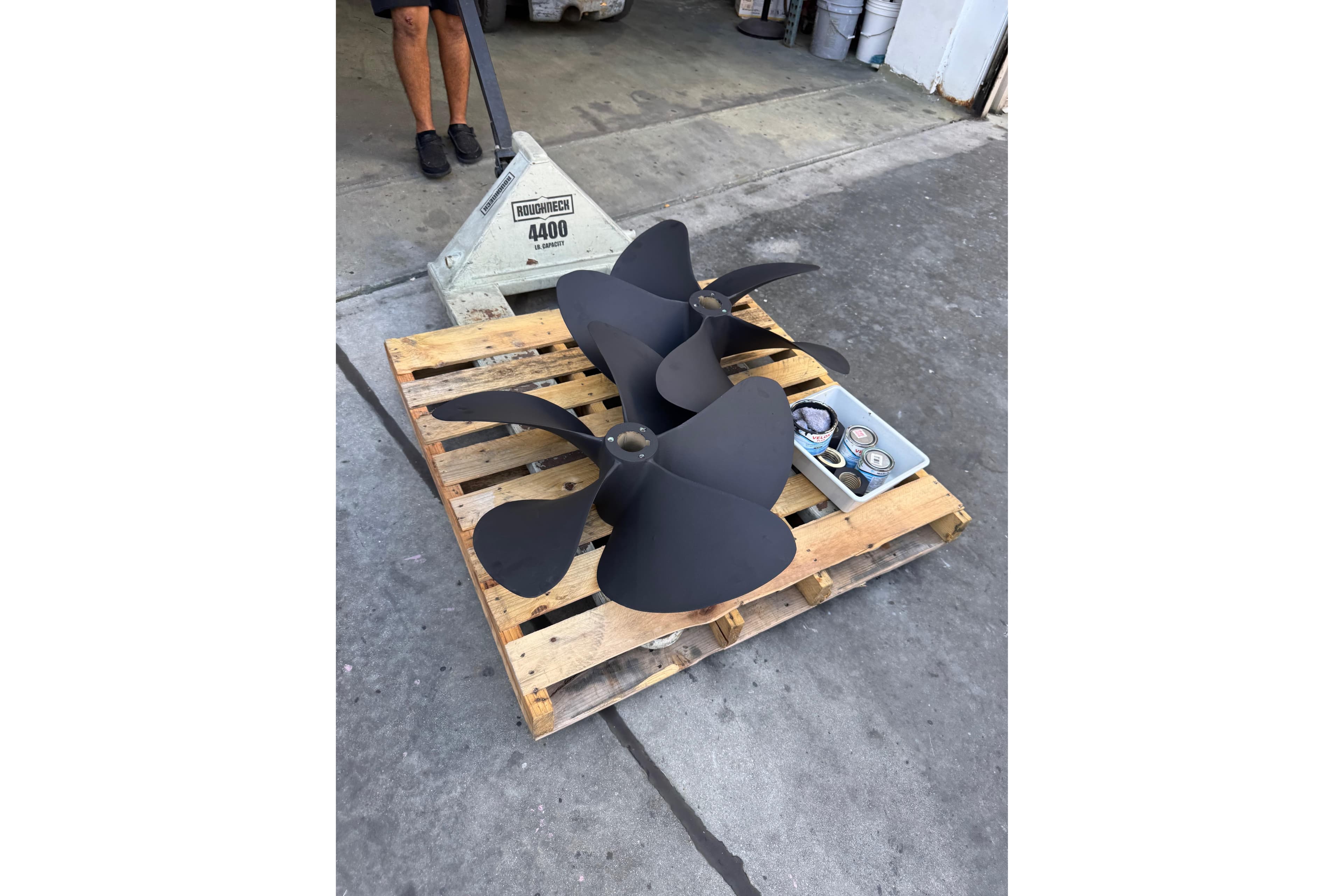 Propellers on a wooden pallet for 2013 Cabo 44 Hardtop Express boat.