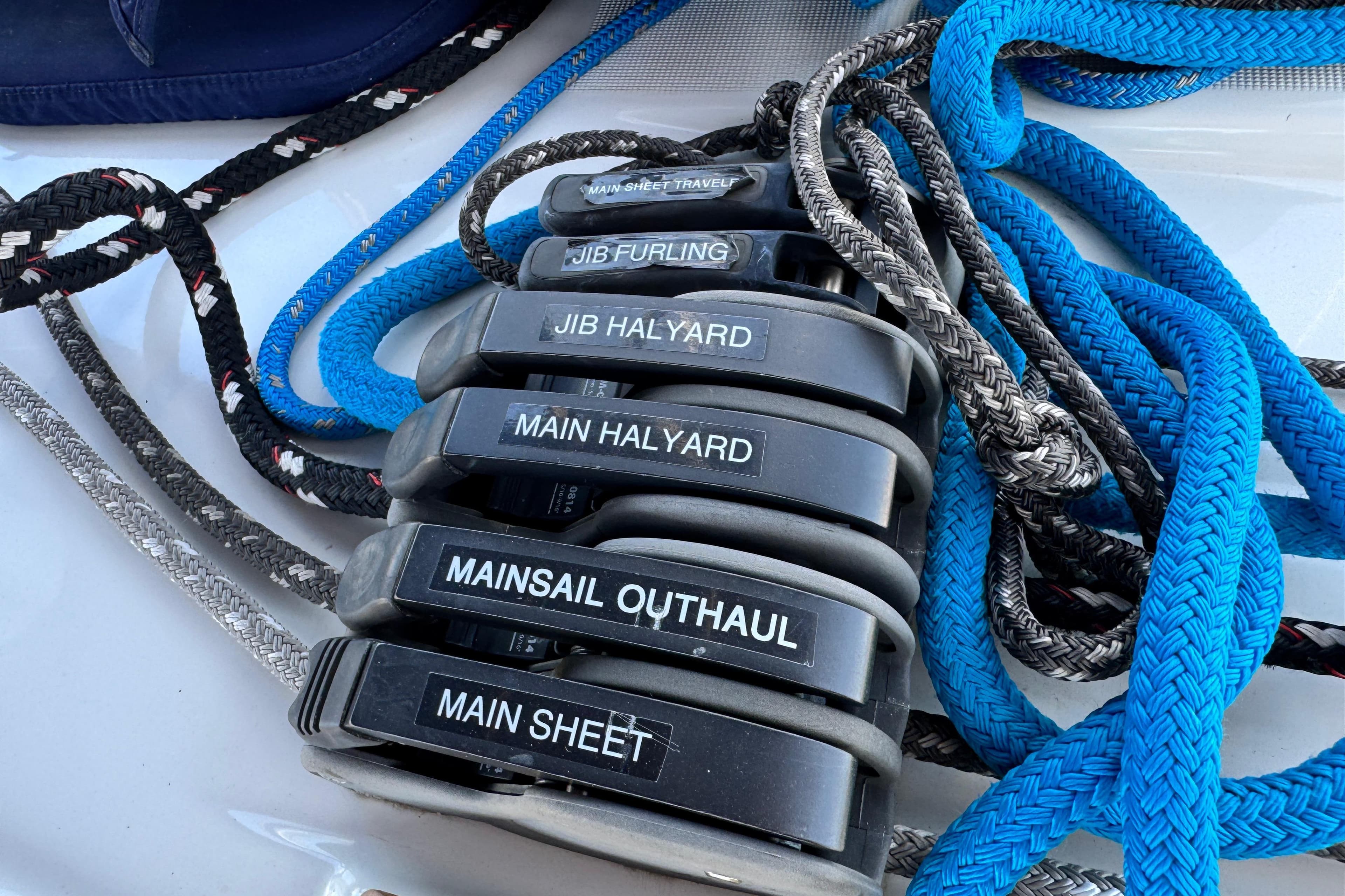 Sailing ropes and clutches on a 2008 Beneteau 49 yacht deck.