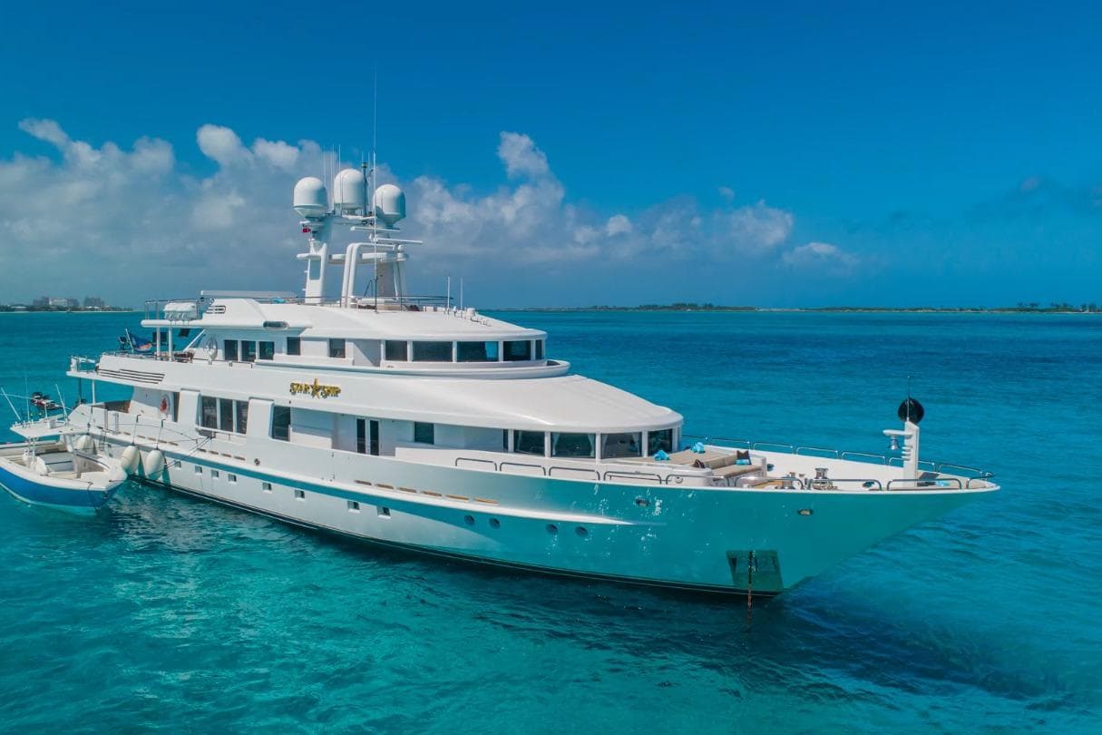 Luxurious 1988 Van Mill 143 Tri-Deck Motor Yacht on clear blue ocean waters.