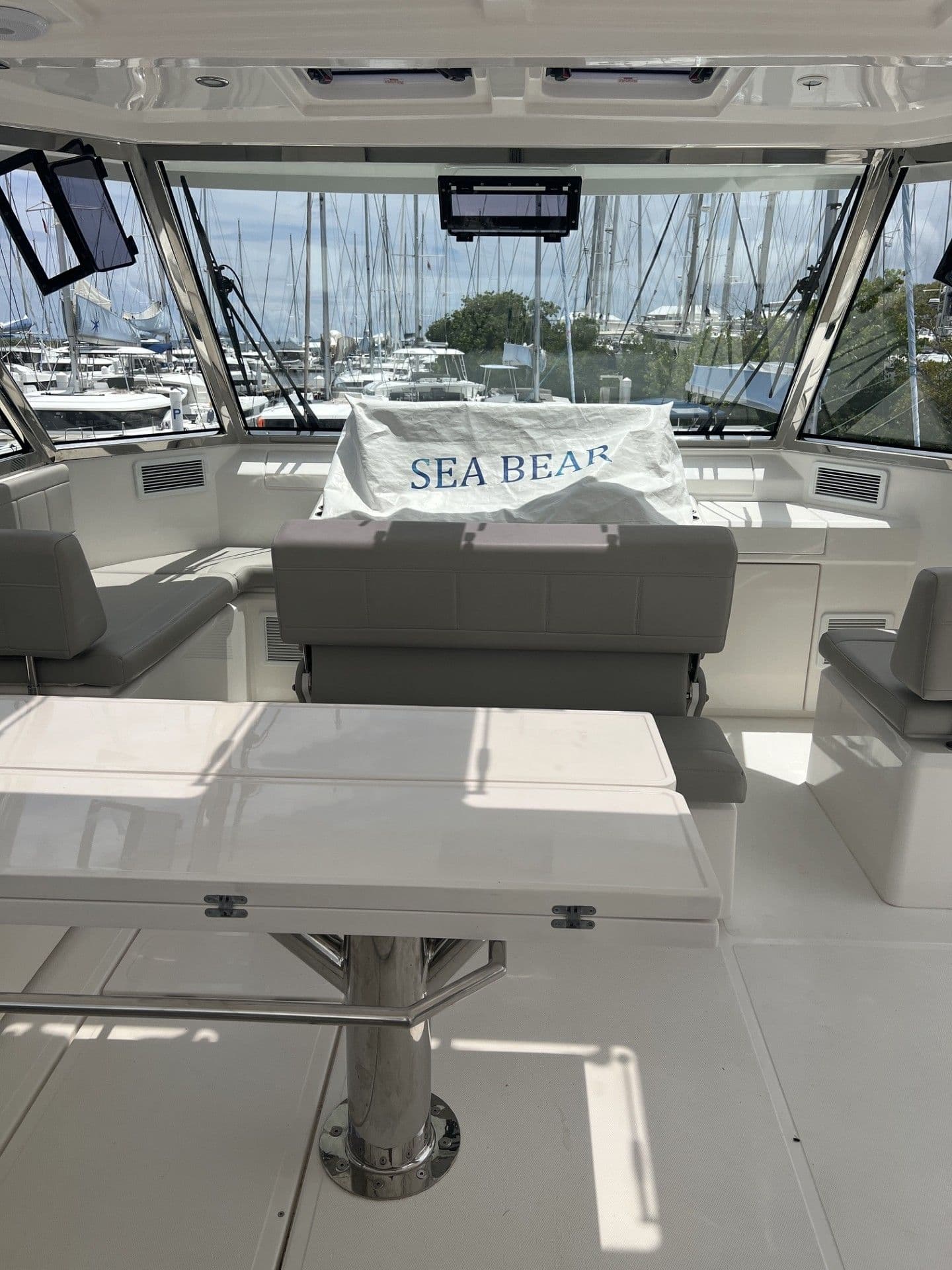 Interior of 2023 Aquila 54 Yacht with table and seating area.