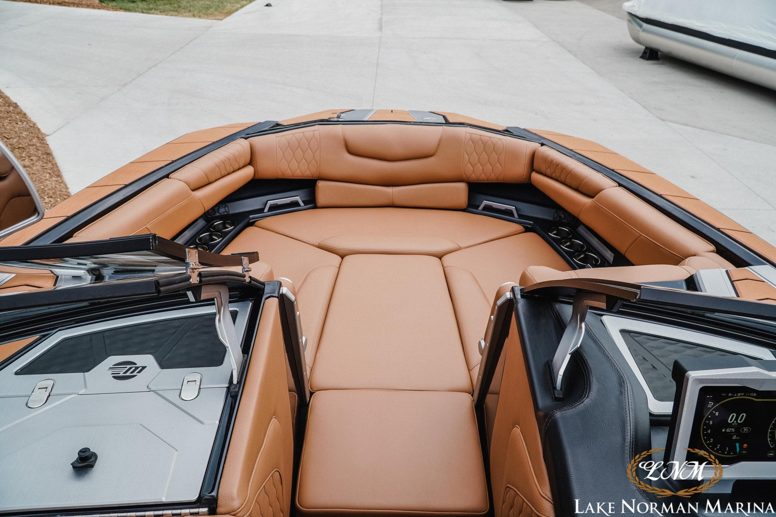 Luxurious interior of 2021 Malibu M240 boat with tan leather seating at Lake Norman Marina.