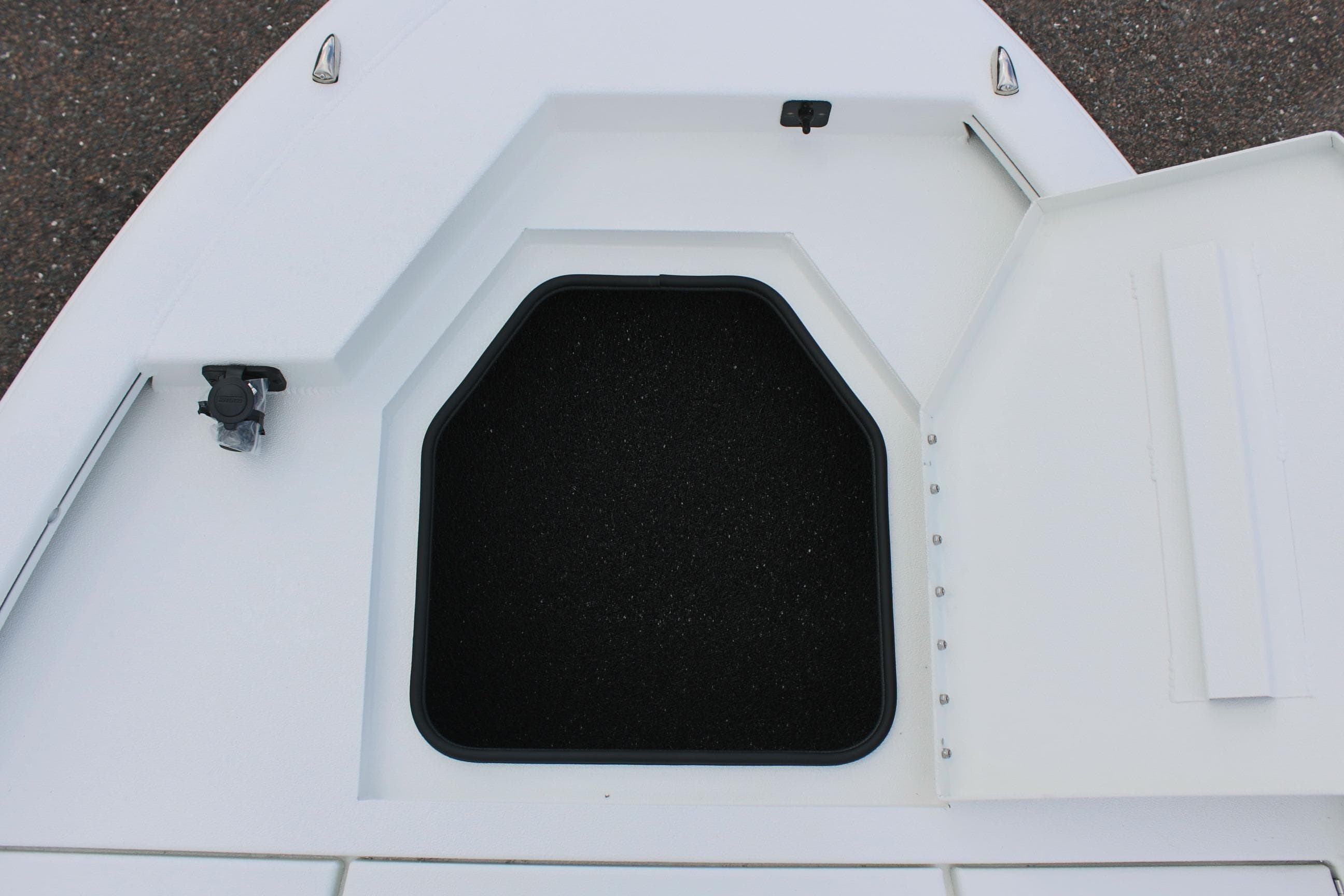 Open storage compartment on 2026 Avid 19 FSX boat deck.
