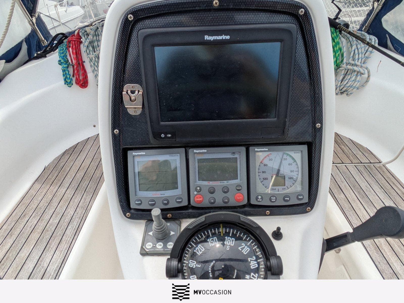 Cockpit of 2006 Bavaria 30 Cruiser with navigation instruments and compass.