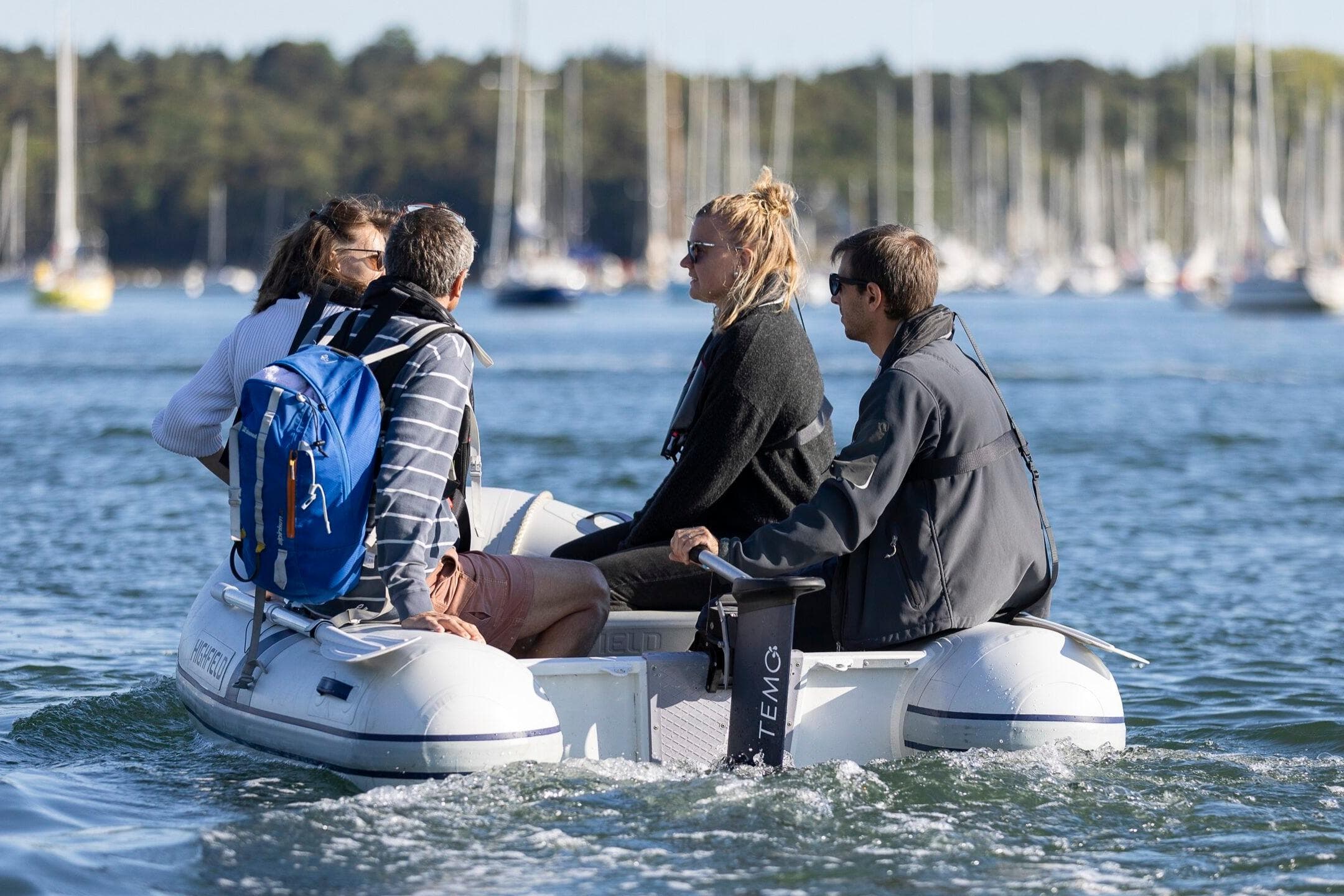 Four people on a Highfield Roll-Up 200 KAM boat, 2026 model.