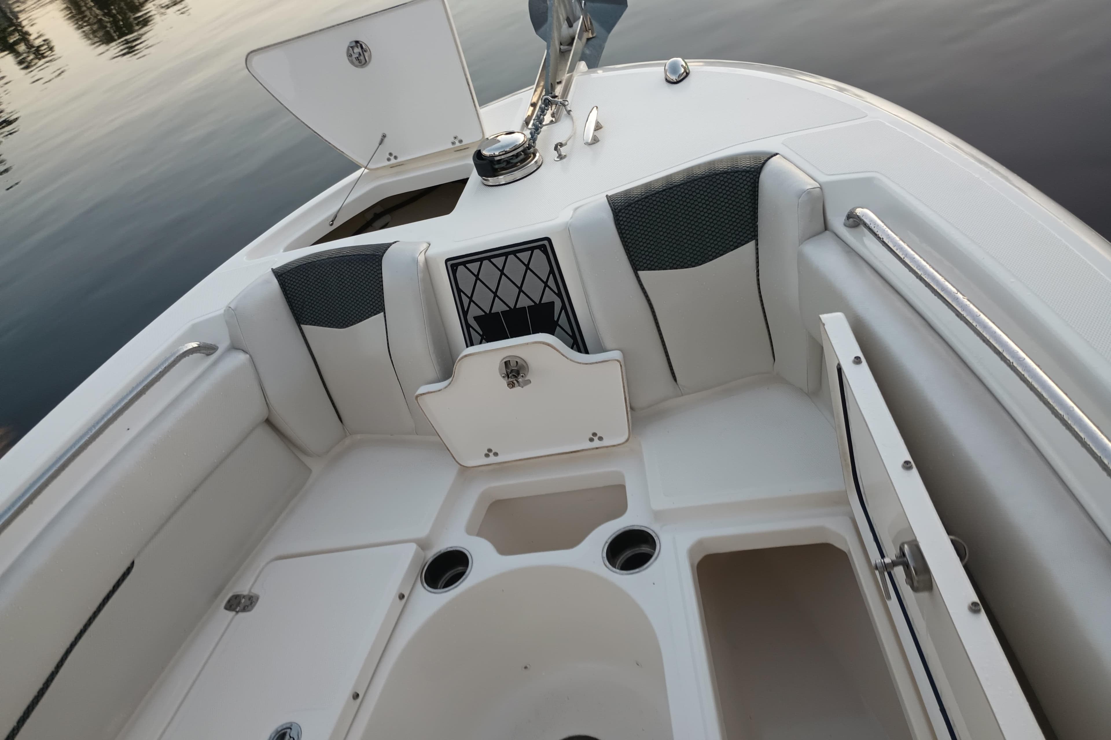 2019 Wellcraft 242 Scarab Offshore boat interior with seating and storage compartments.