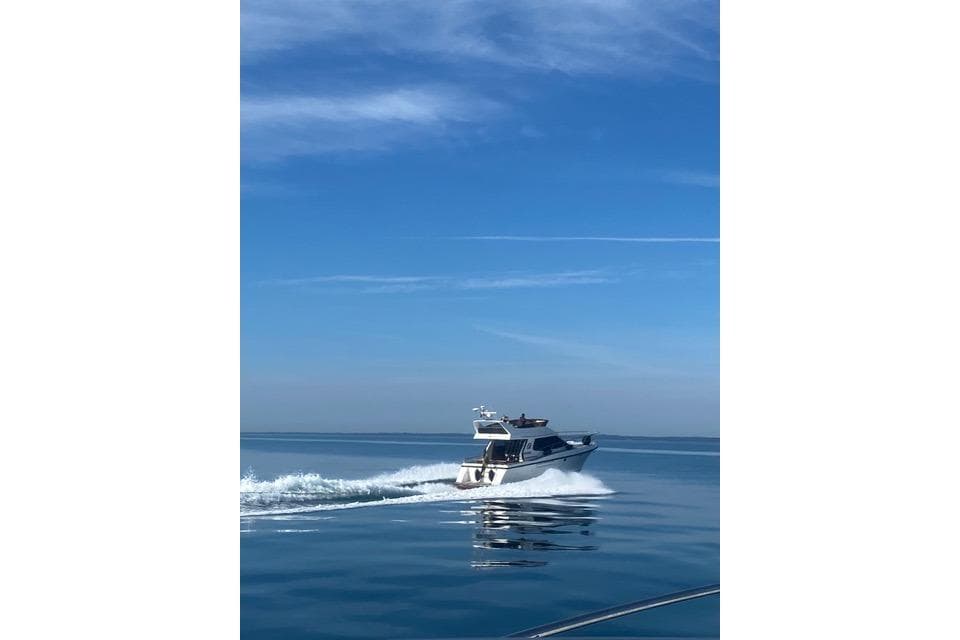 Storebro 430 Royal Cruiser 1998 navigating calm blue waters under clear skies.