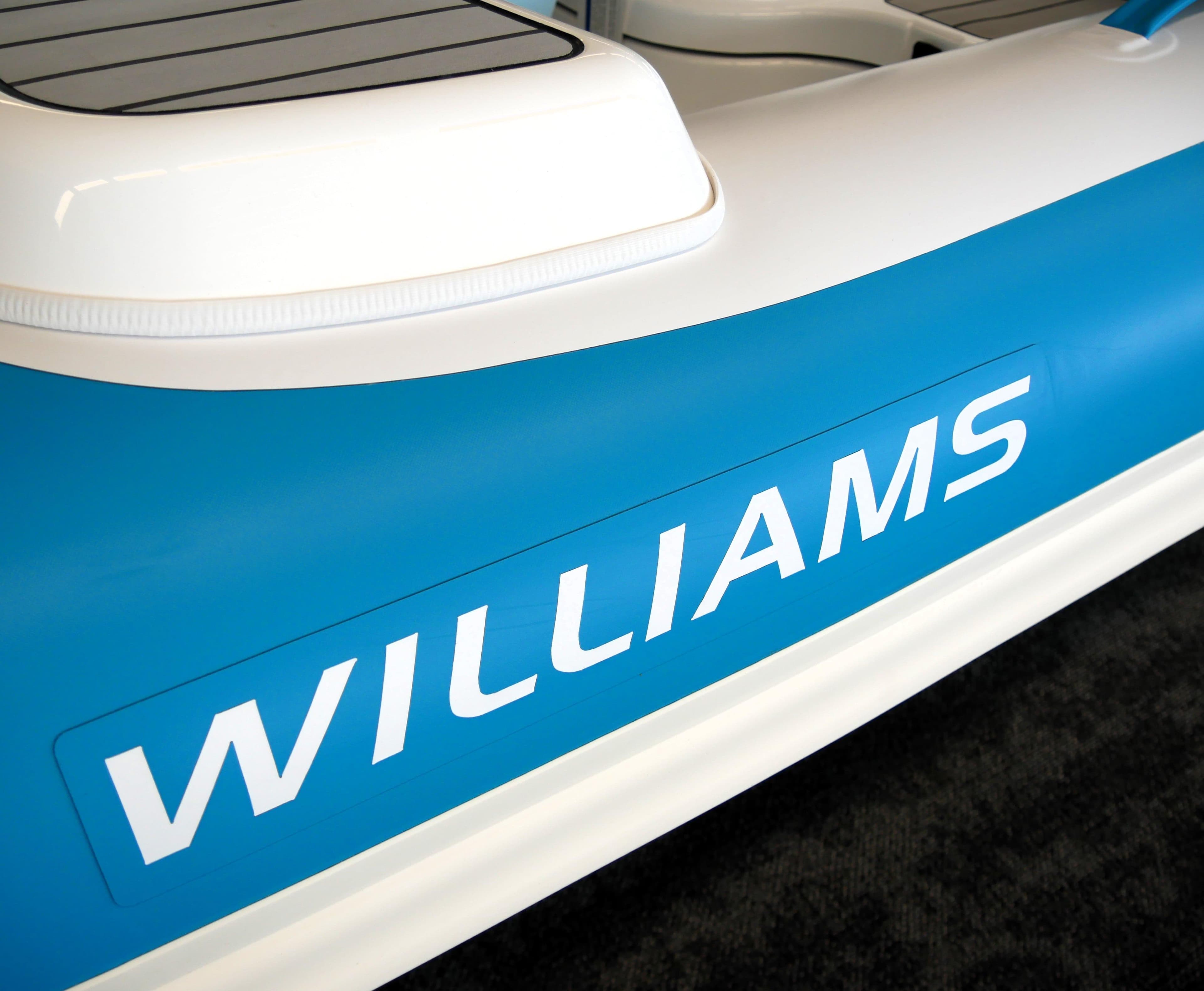 2025 Williams Jet Tenders TurboJet 285LP, blue and white design, close-up view.