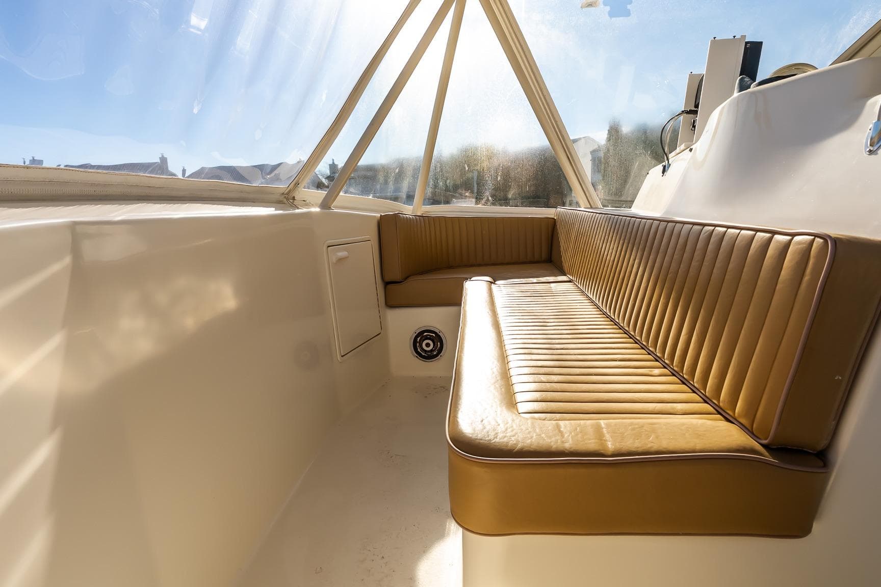 Interior seating of 1998 Ocean Yachts 48 Super Sport, featuring tan leather upholstery.
