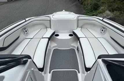 2018 Yamaha Boats SX210 interior with white seating and cup holders.