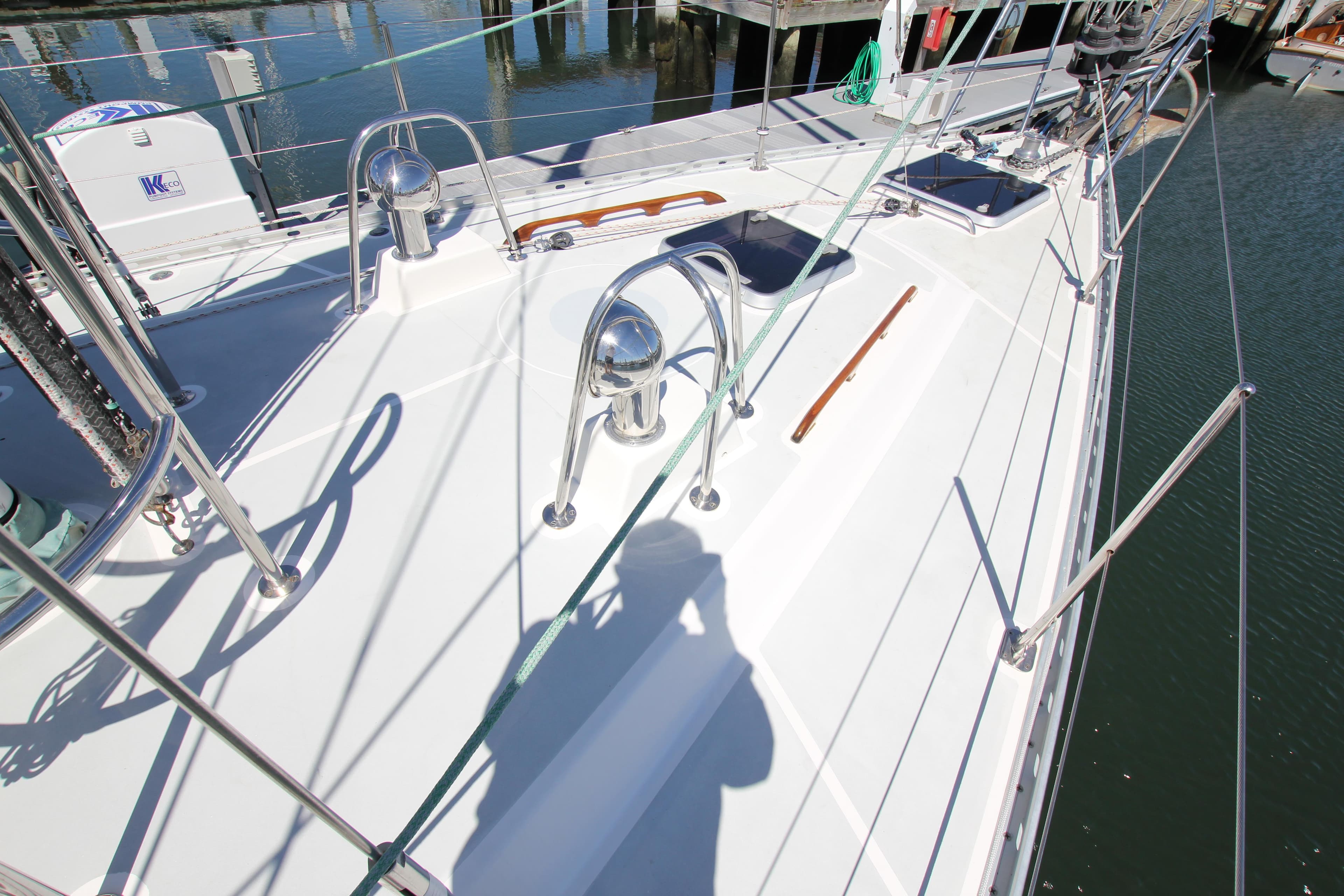 Deck of 1998 Able Apogee 50 sailboat with polished fittings and ropes.