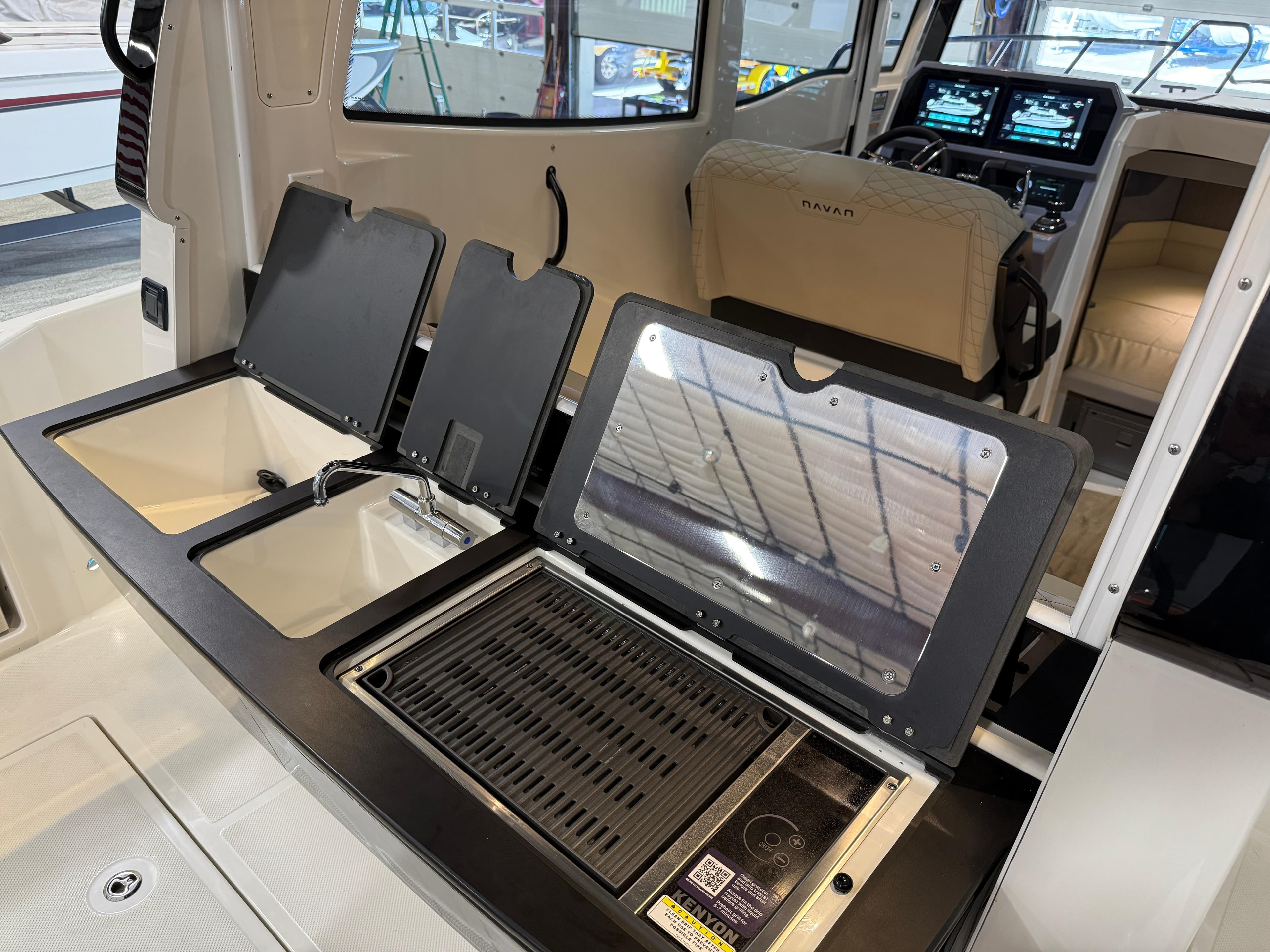 Navan C30 2025 boat interior with modern kitchen and navigation controls.