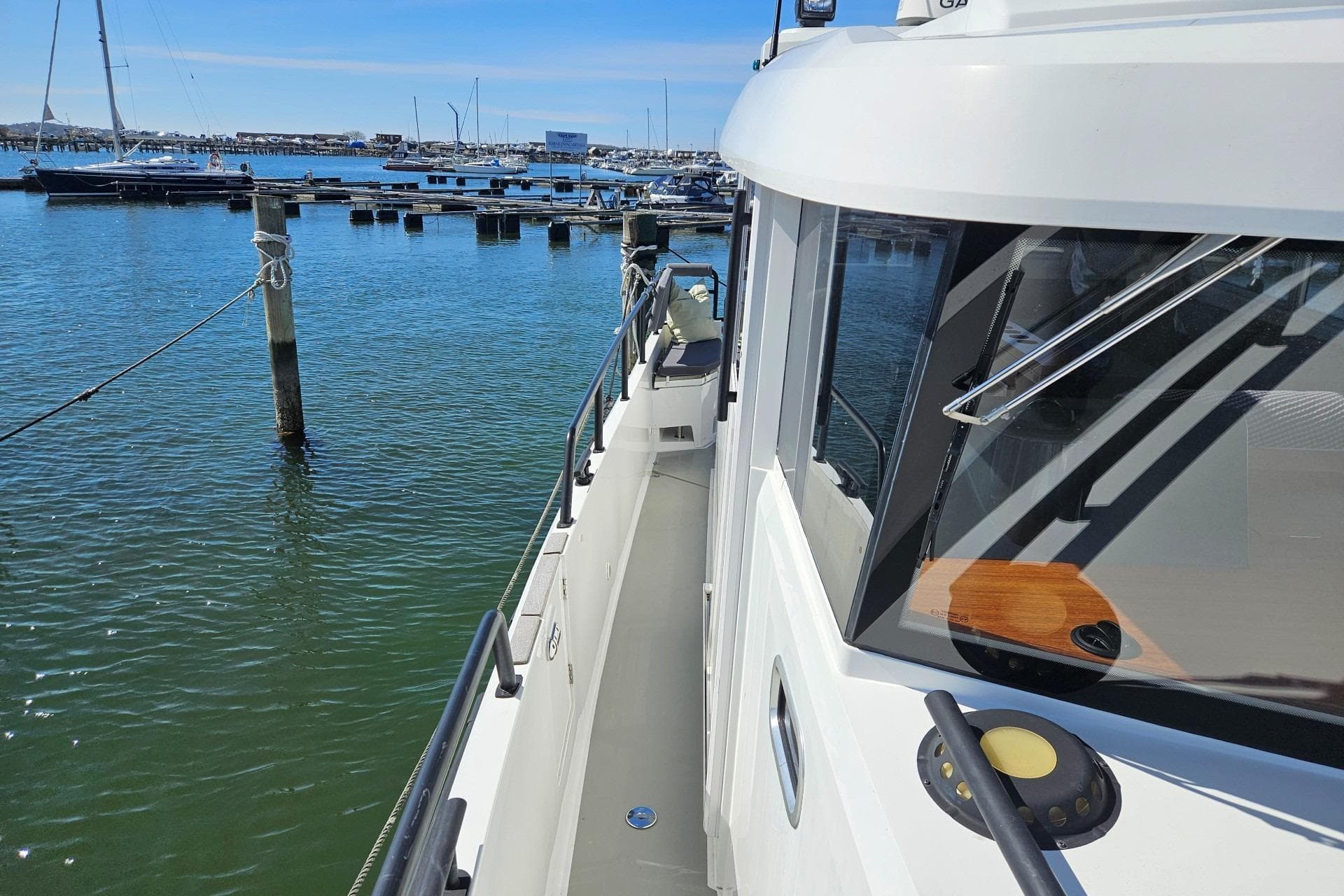 2017 Sargo 33 Explorer docked at a marina, showcasing sleek design and spacious deck.