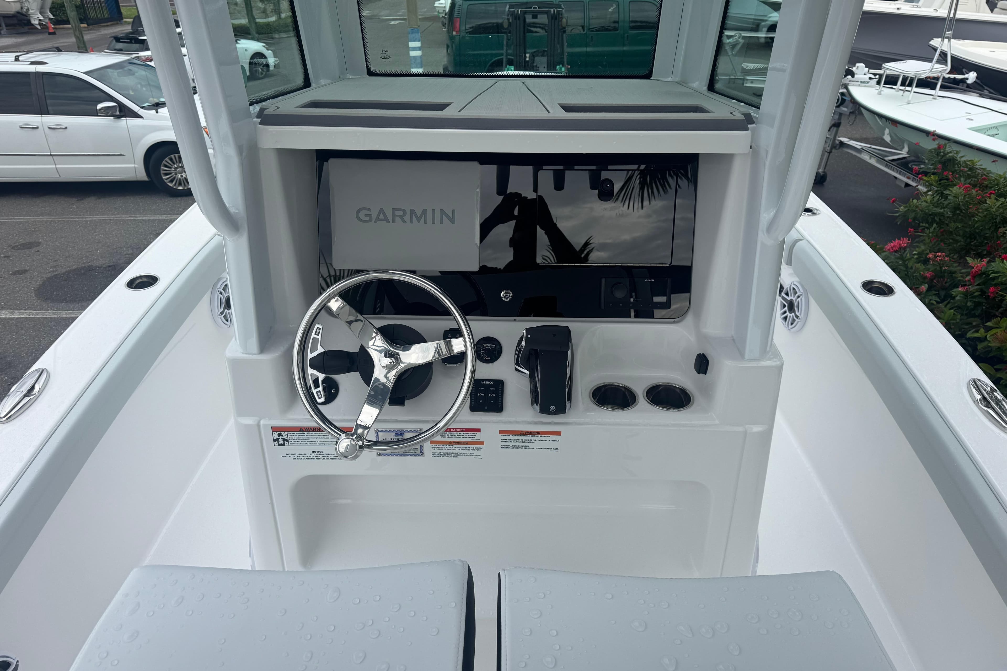 2026 Blackfin 262 HB boat helm with Garmin navigation system and steering wheel.