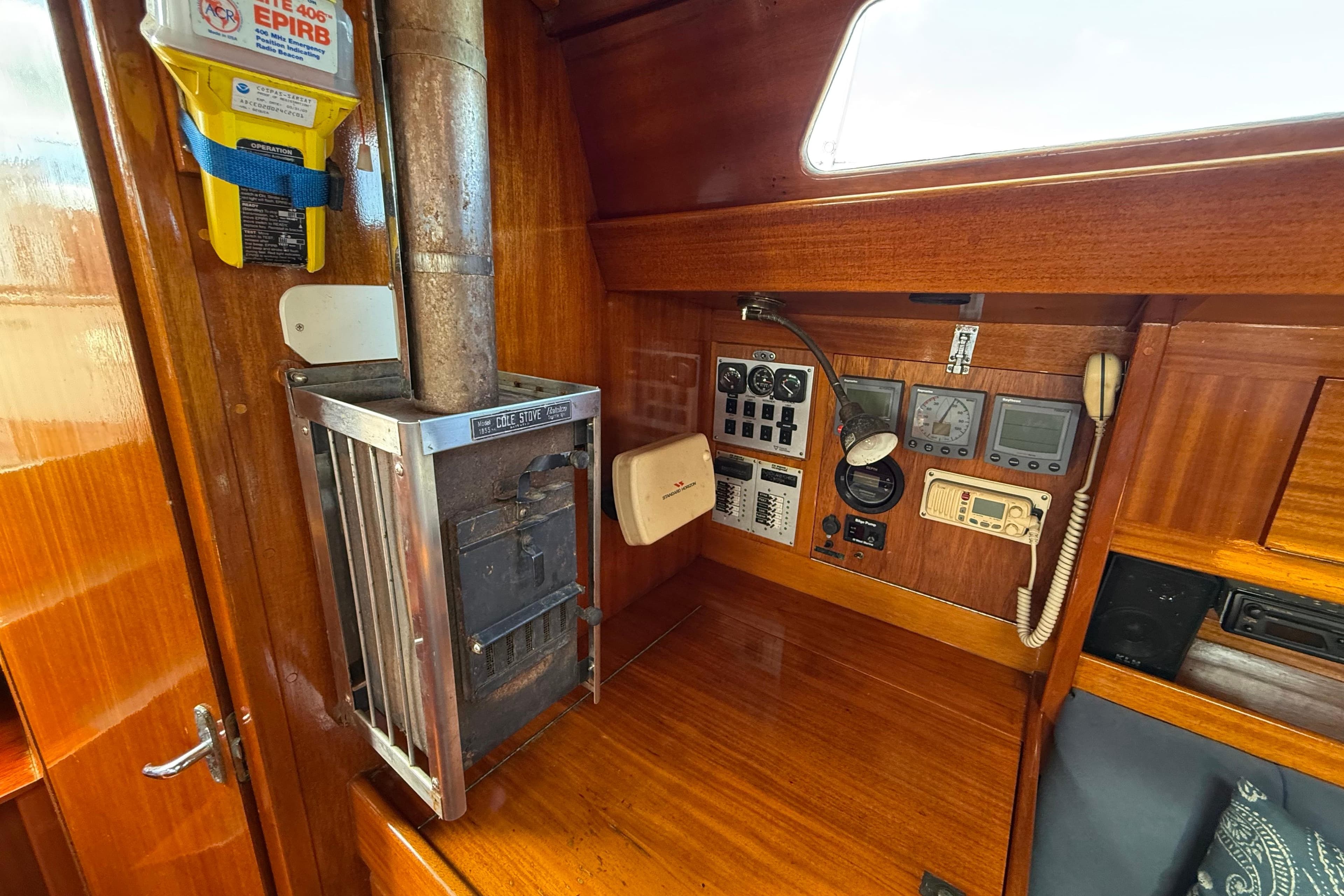 Control panel and stove inside a 1986 Vindo 45 sailboat cabin.
