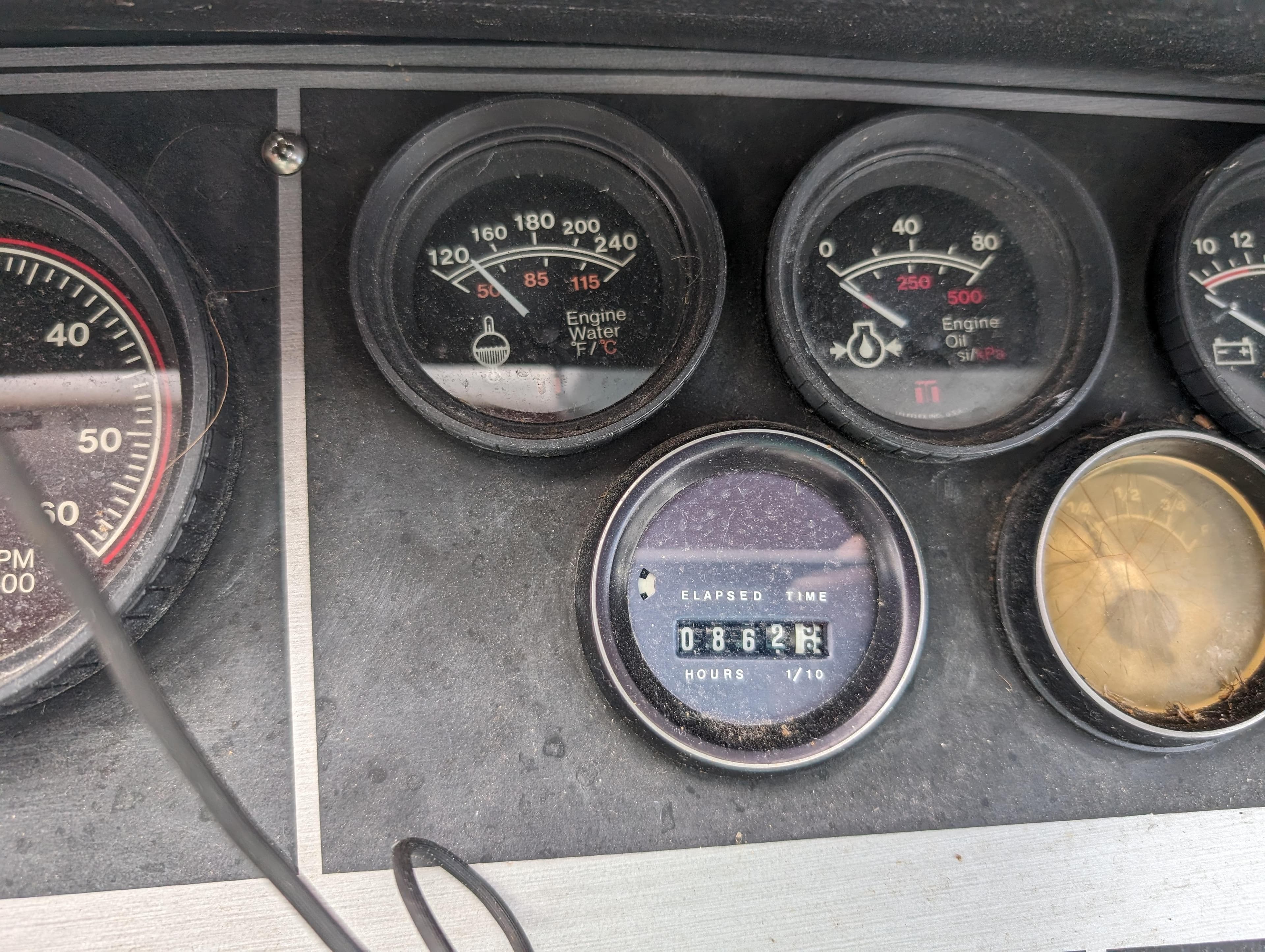 Close-up of 1987 Cruisers 3370 Esprit boat dashboard gauges.