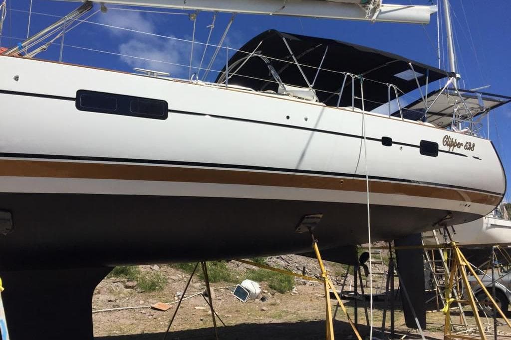2006 Beneteau Oceanis Clipper 523 sailboat on dry dock, side view.