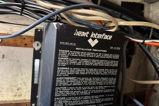 Electrical panel with Heart Interface installation precautions on 1989 Island Packet 35 sailboat.