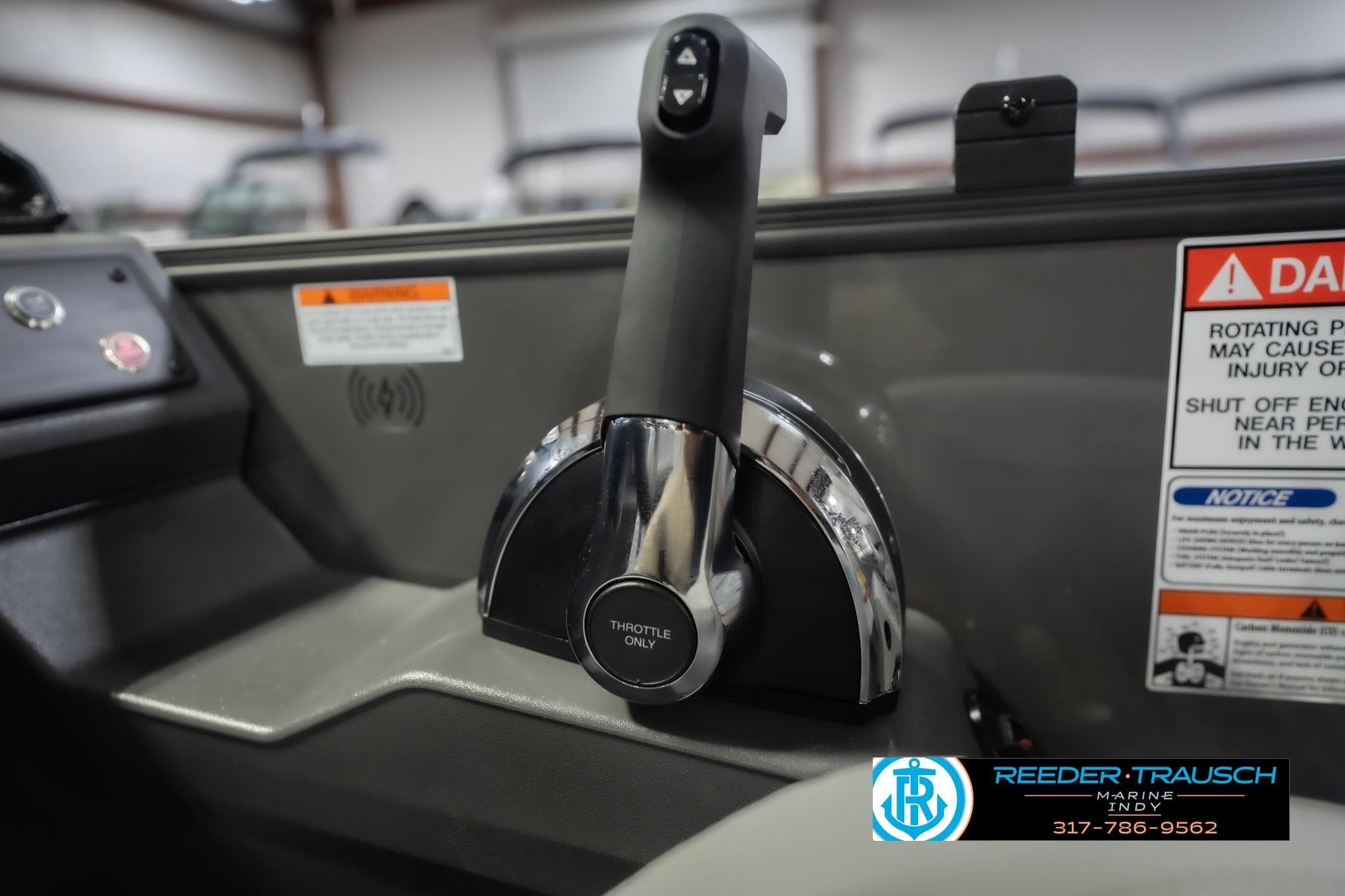 Throttle control of 2026 Bennington 22 SF boat with safety warnings and Reeder Trausch Marine logo.