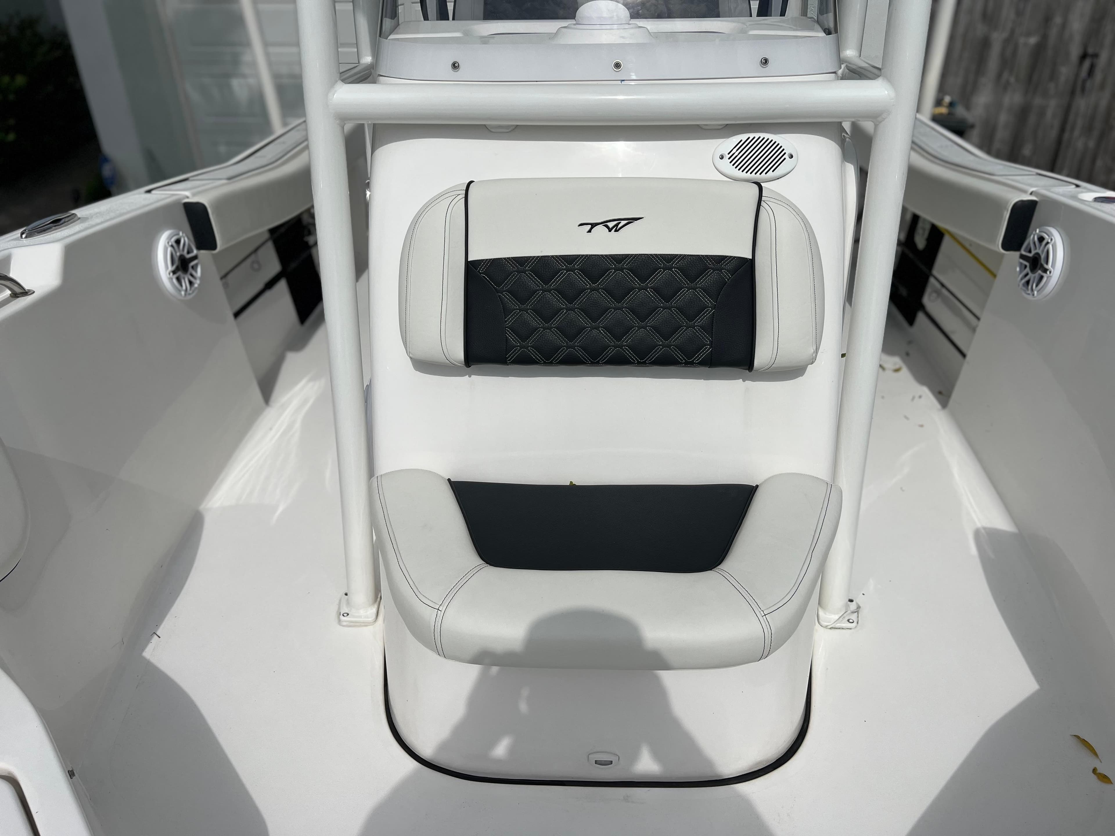 2023 Tidewater 220 CC Adventure boat interior seating with black and white upholstery.