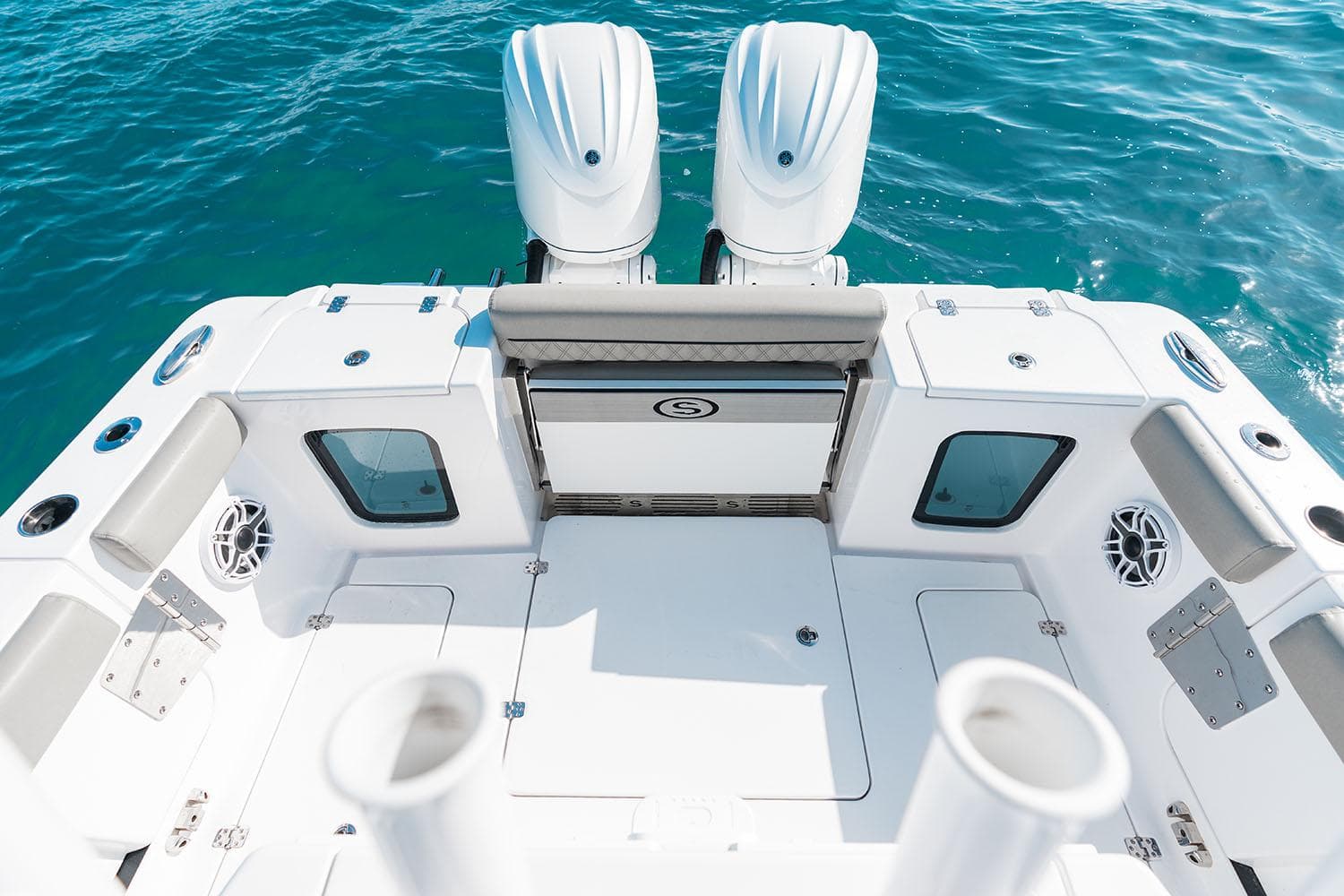 Manufacturer Provided Image: 2025 Sportsman Open 282 Center Console boat deck with twin engines on blue water.