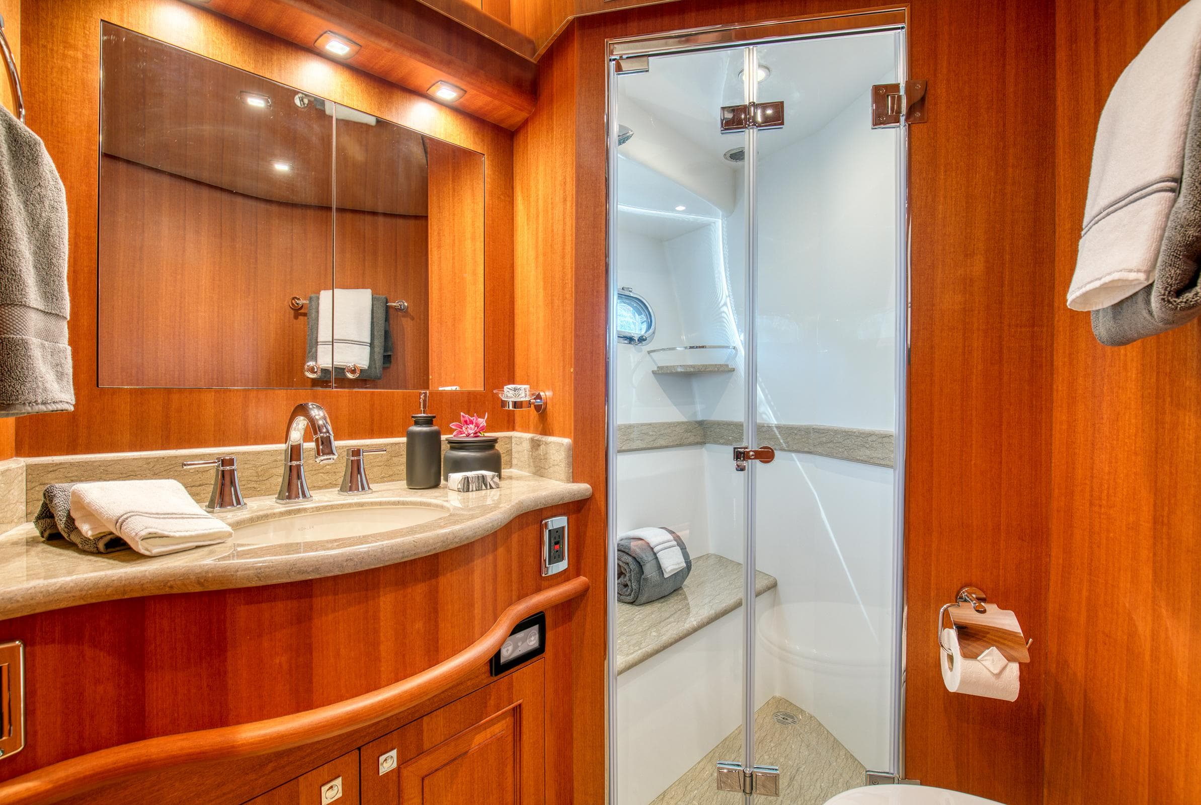 Luxurious bathroom in 2025 Hampton 750 Endurance LRC yacht with wood accents and modern fixtures.