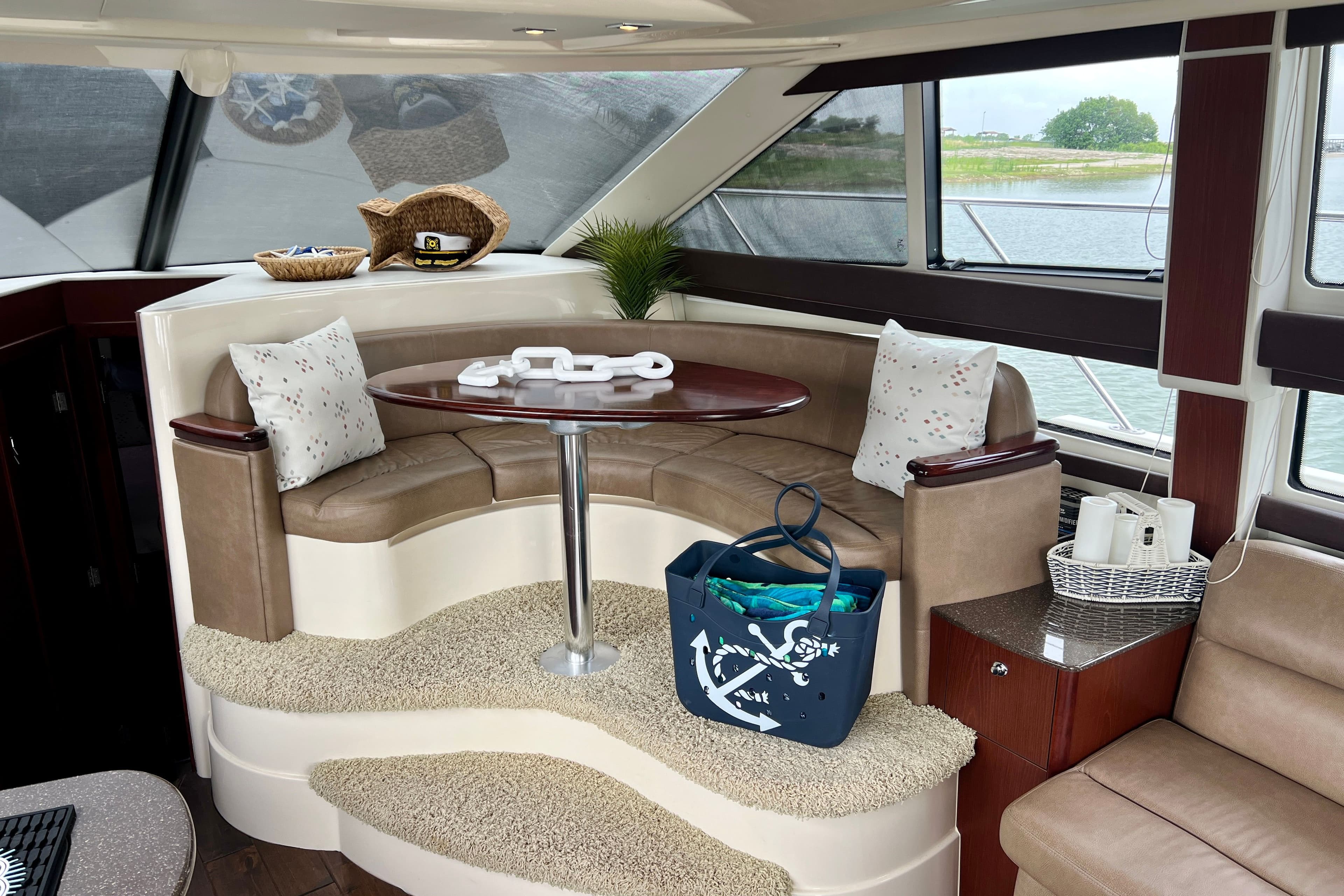 Interior of a 2013 Meridian 391 Sedan yacht with elegant seating area.