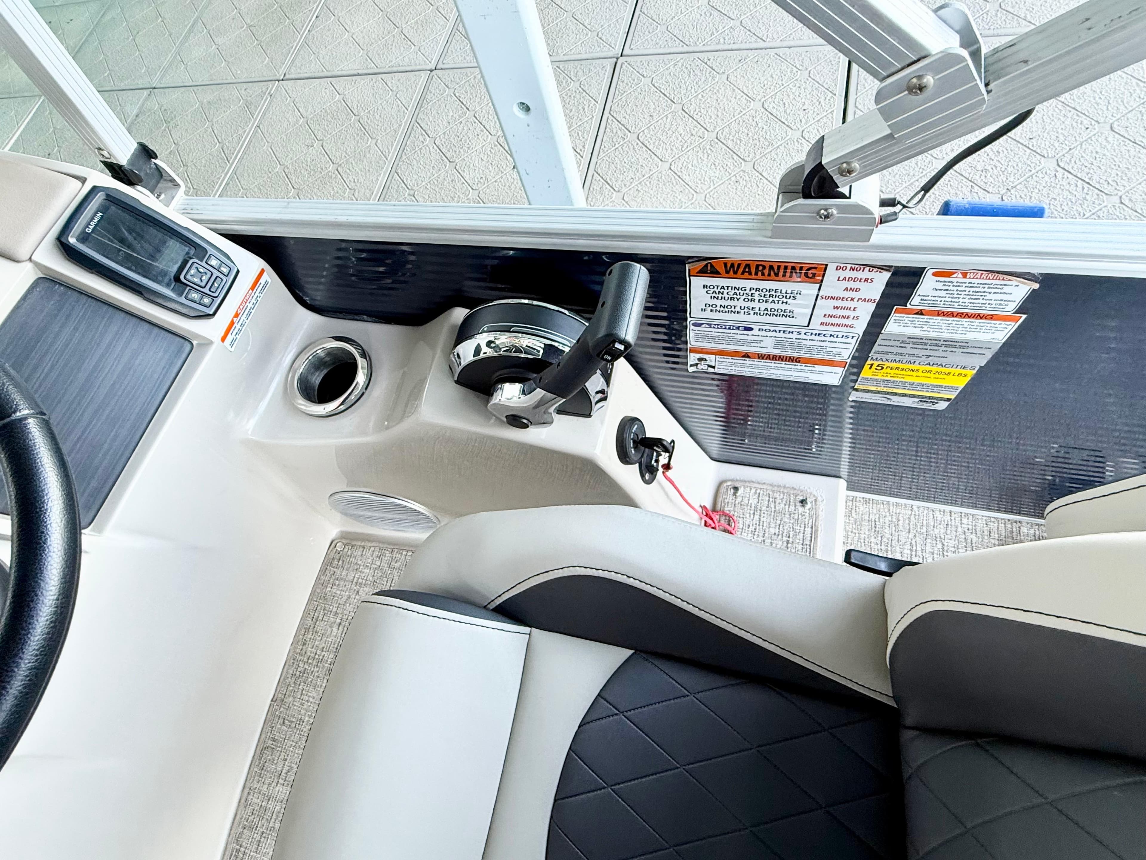 2019 Bennington SX 25 Premium Swingback boat interior with control panel and seating.