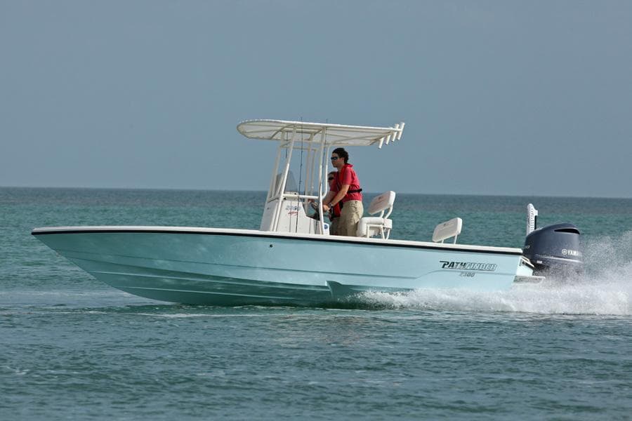Manufacturer Provided Image: 2026 Pathfinder 2300 HPS boat cruising on open water with driver.