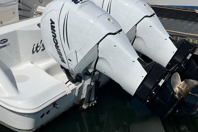 2006 Boston Whaler 320 Outrage Cuddy Cabin with twin Mercury outboard engines.