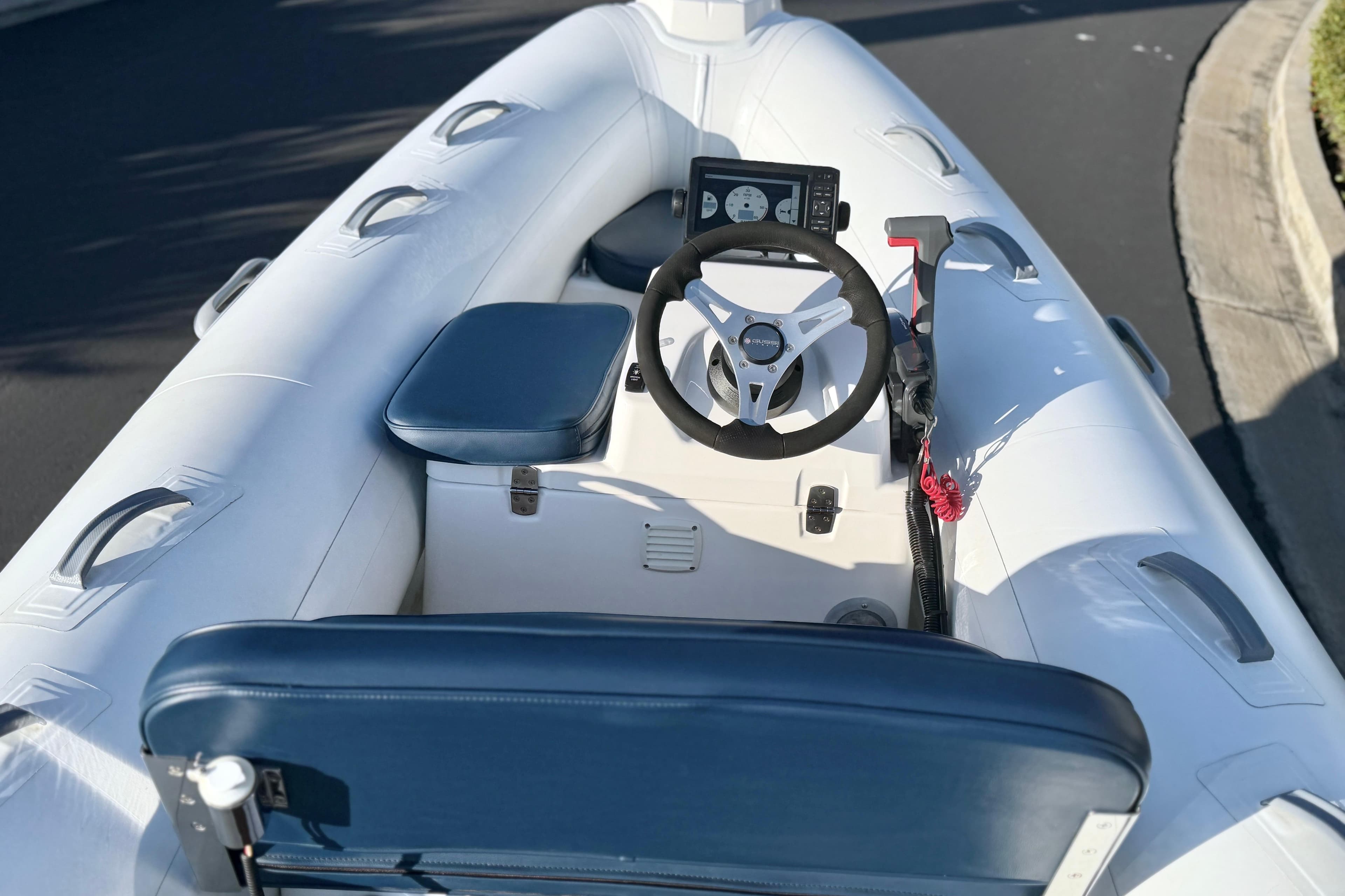 2018 Brig Falcon 360 inflatable boat interior with steering wheel and seating.