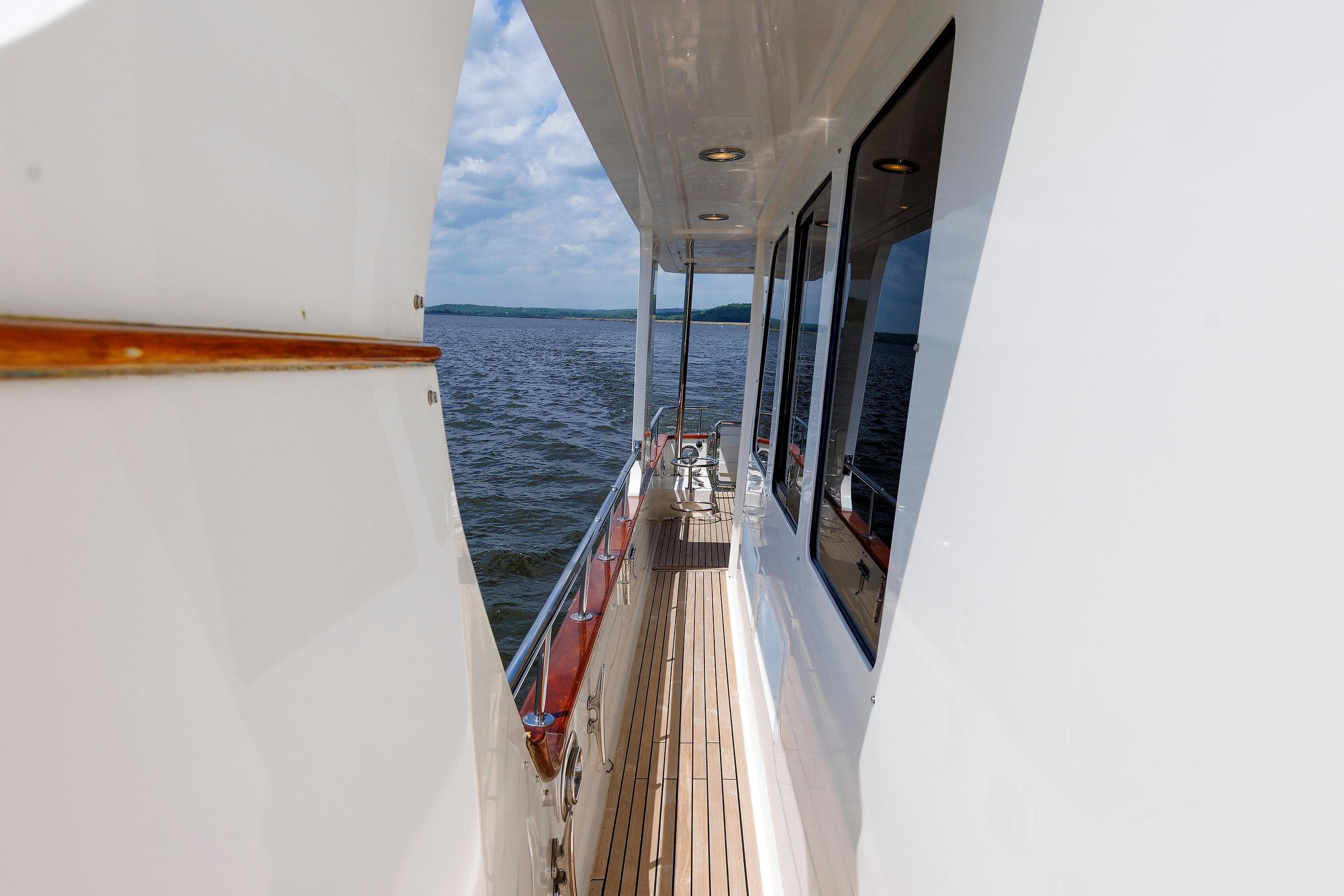 Side deck view of 2007 Grand Banks 59 Aleutian RP yacht on open water.