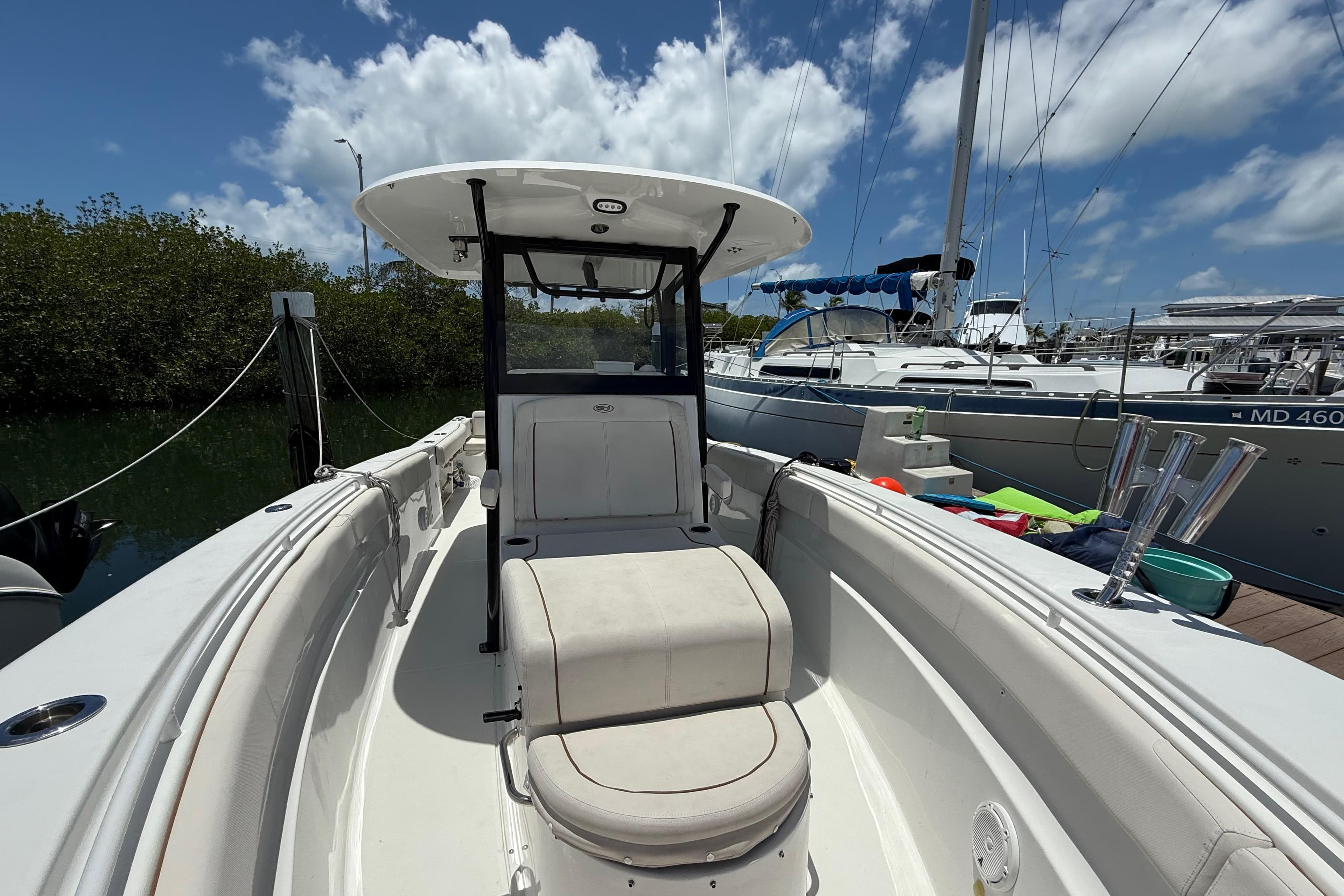 2022 Sea Hunt Gamefish 30 Coffin Box boat docked under blue sky.
