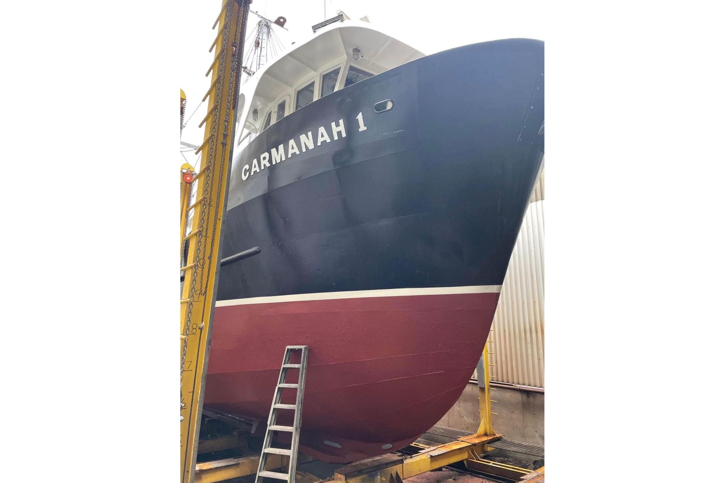 1974 Frostad commercial fishing boat "Carmanah 1" in dry dock with ladder.