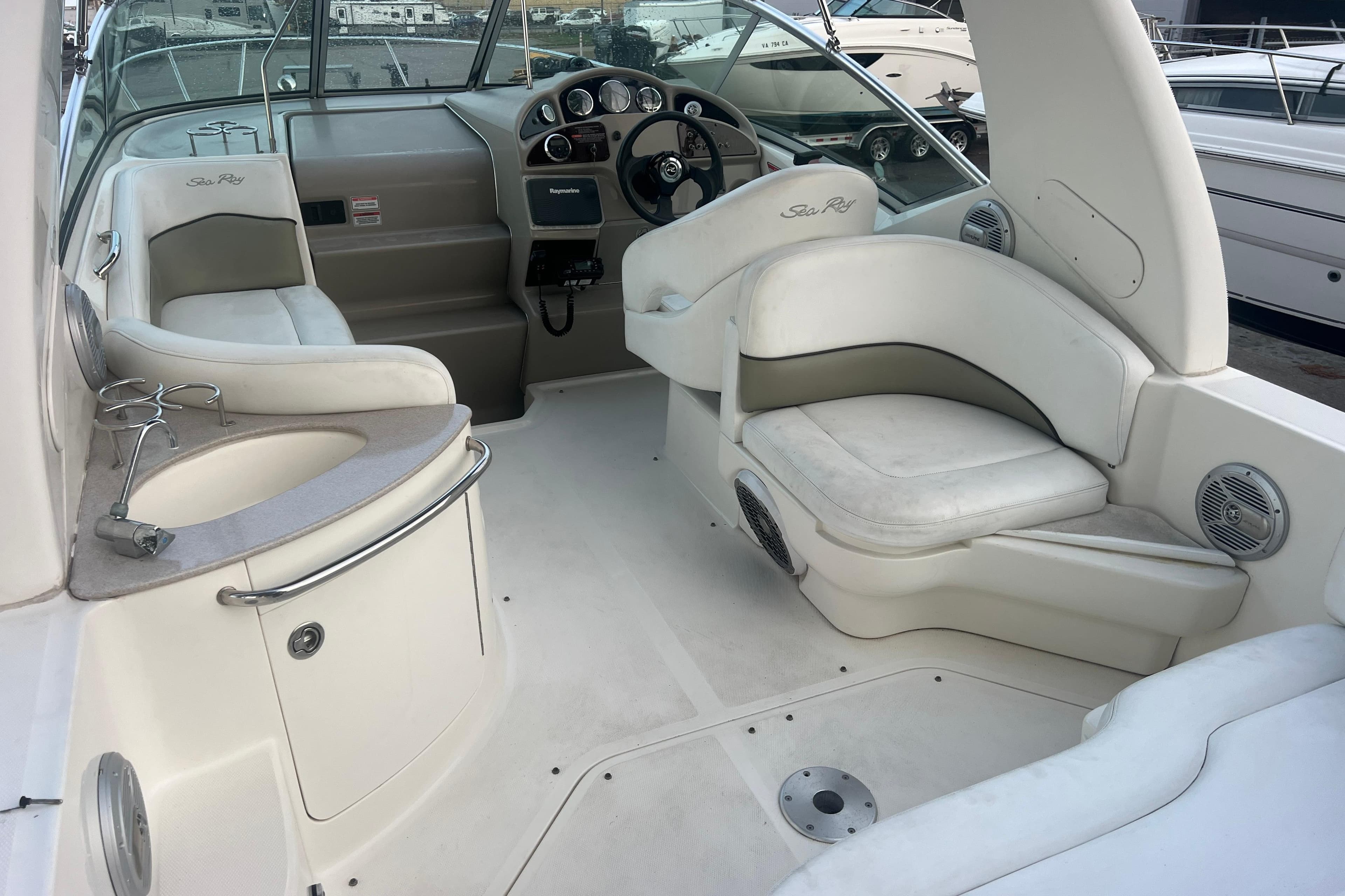 2007 Sea Ray 260 Sundancer boat interior with seating and helm.