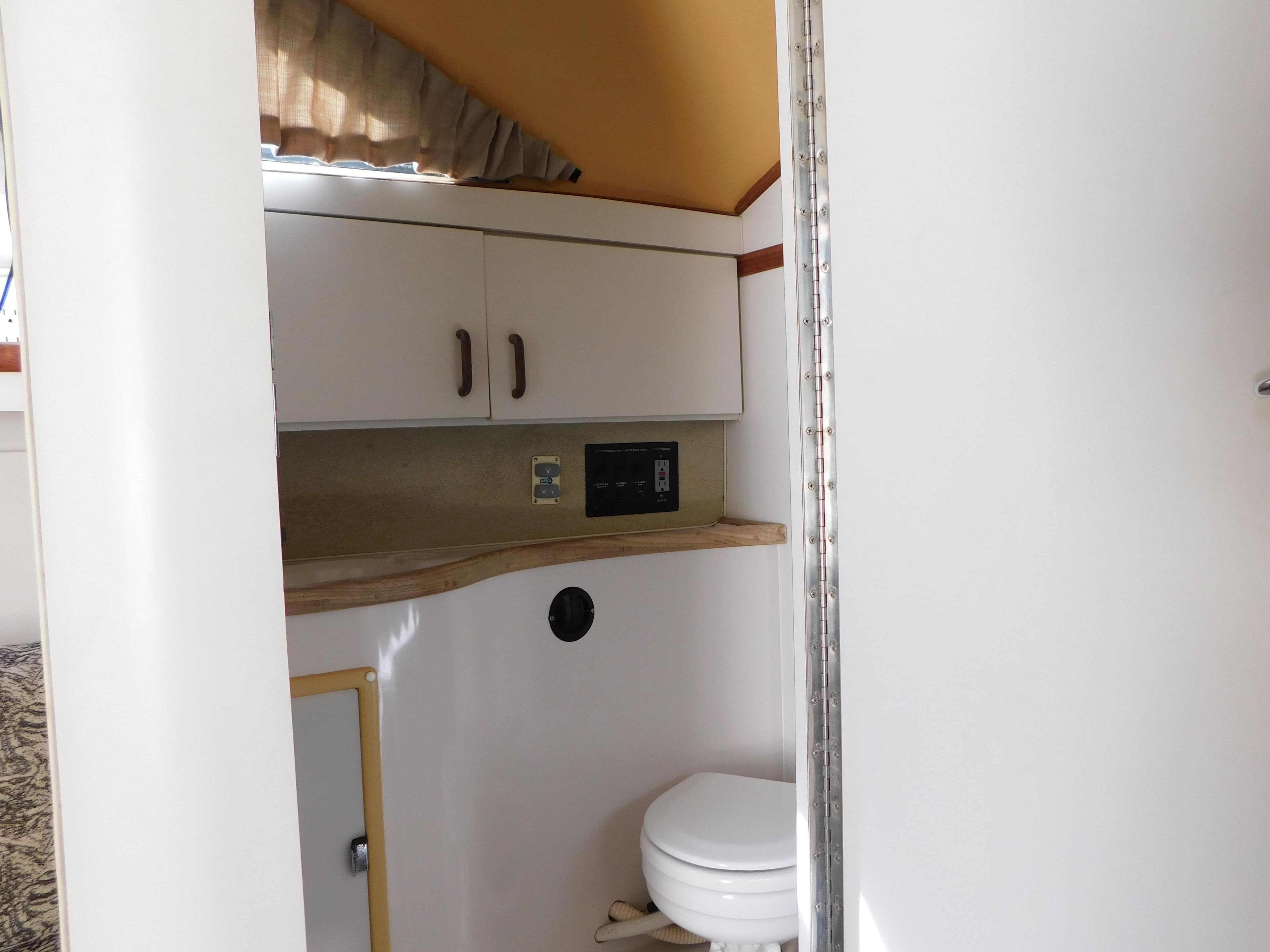 Interior view of 1991 Wellcraft Sport Bridge 3300 boat bathroom.