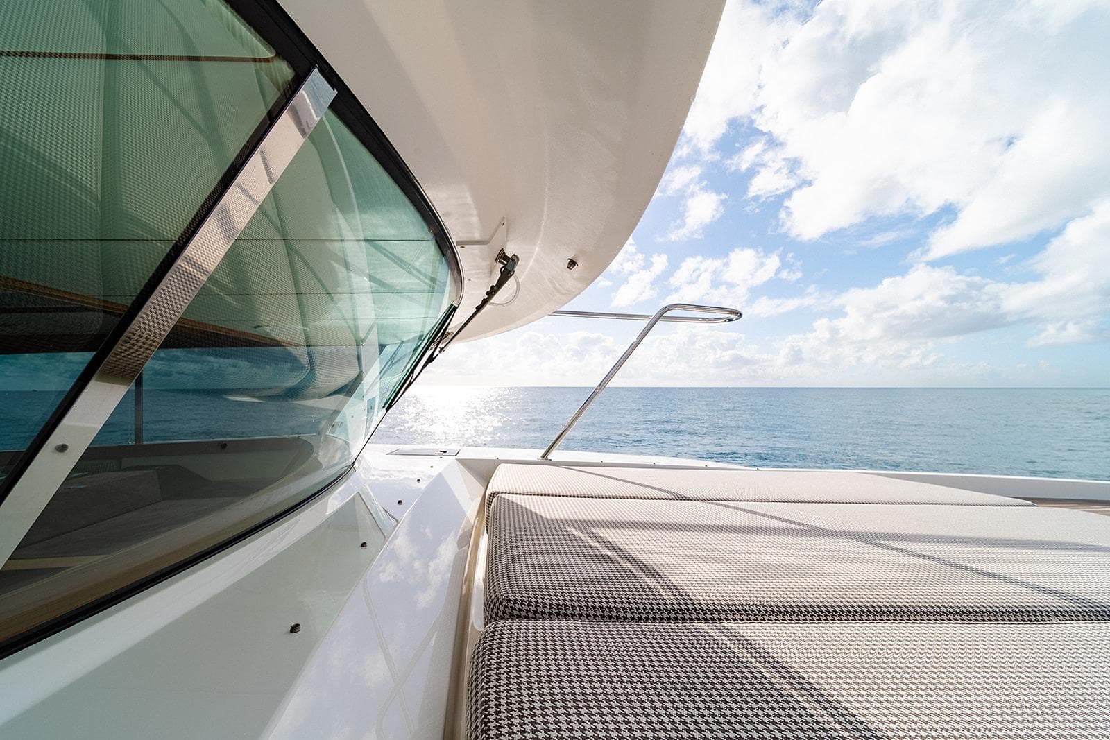 2023 Delta Powerboats 54 IPS yacht, ocean view, sunny day, modern design, luxury boating.