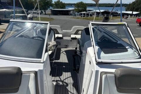 2016 Yamaha Boats 242 Limited E-Series interior with open cockpit and lake view.